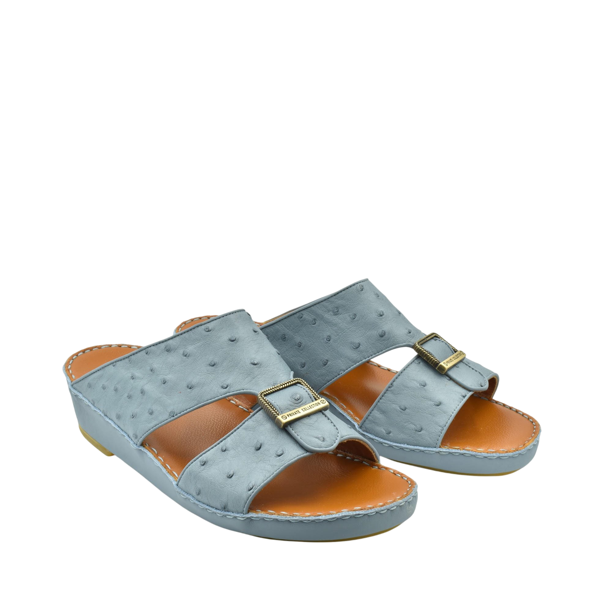 Gray luxury leather sandals with buckle detail and cushioned tan footbed from Private collection