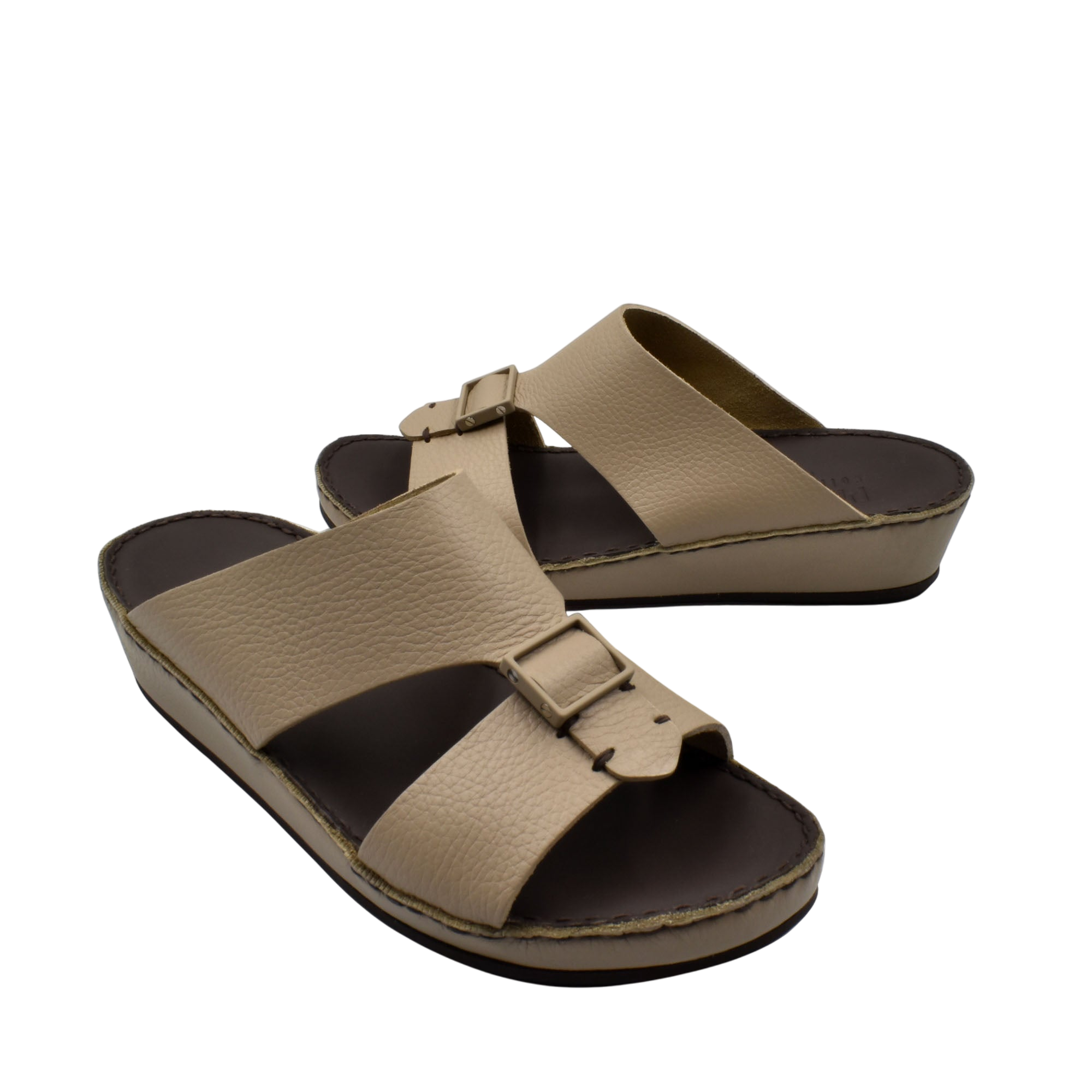 Beige deercalf leather sandals with adjustable buckle straps and cushioned footbed for comfort