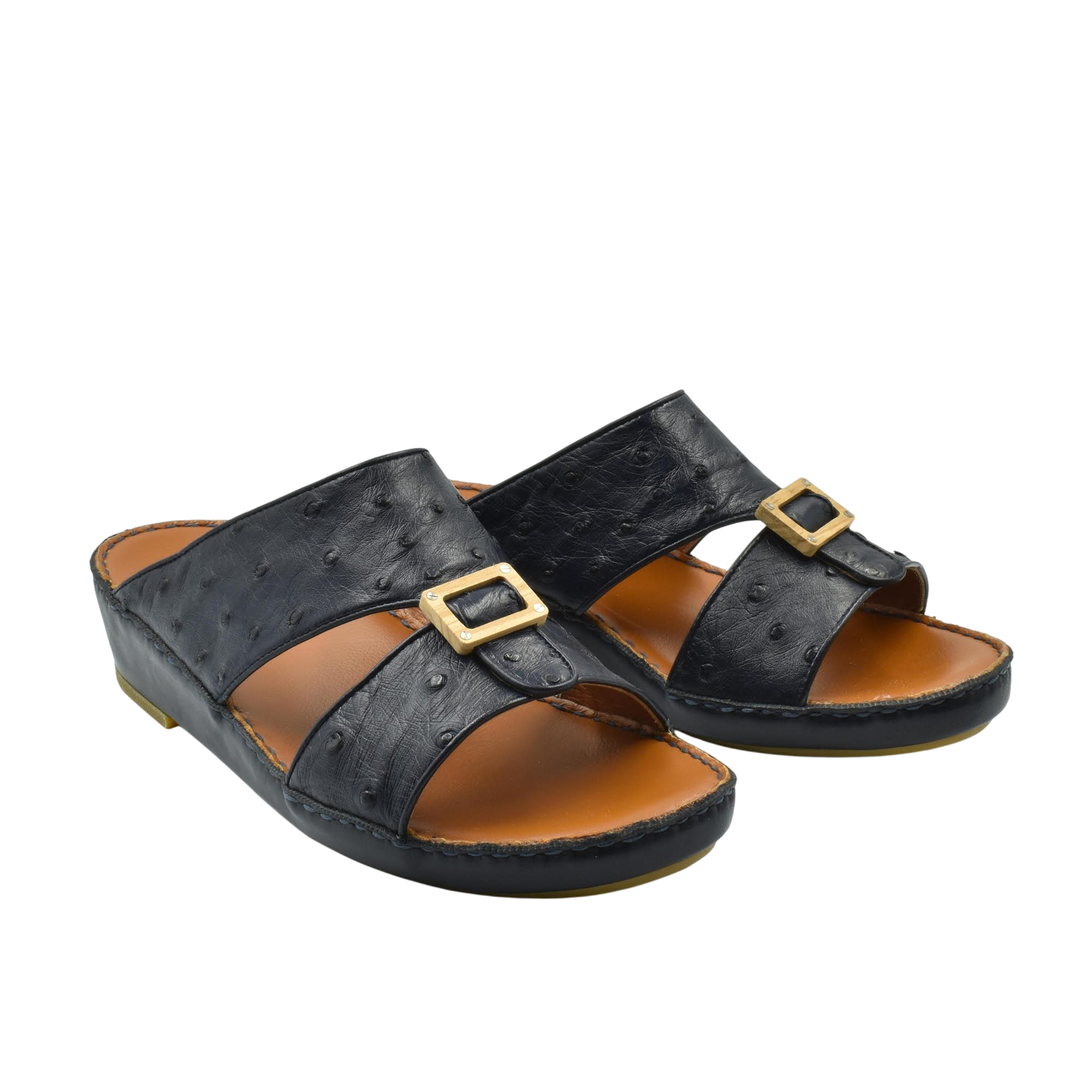 Black handcrafted olive sandals with gold buckle detail and comfortable brown footbed