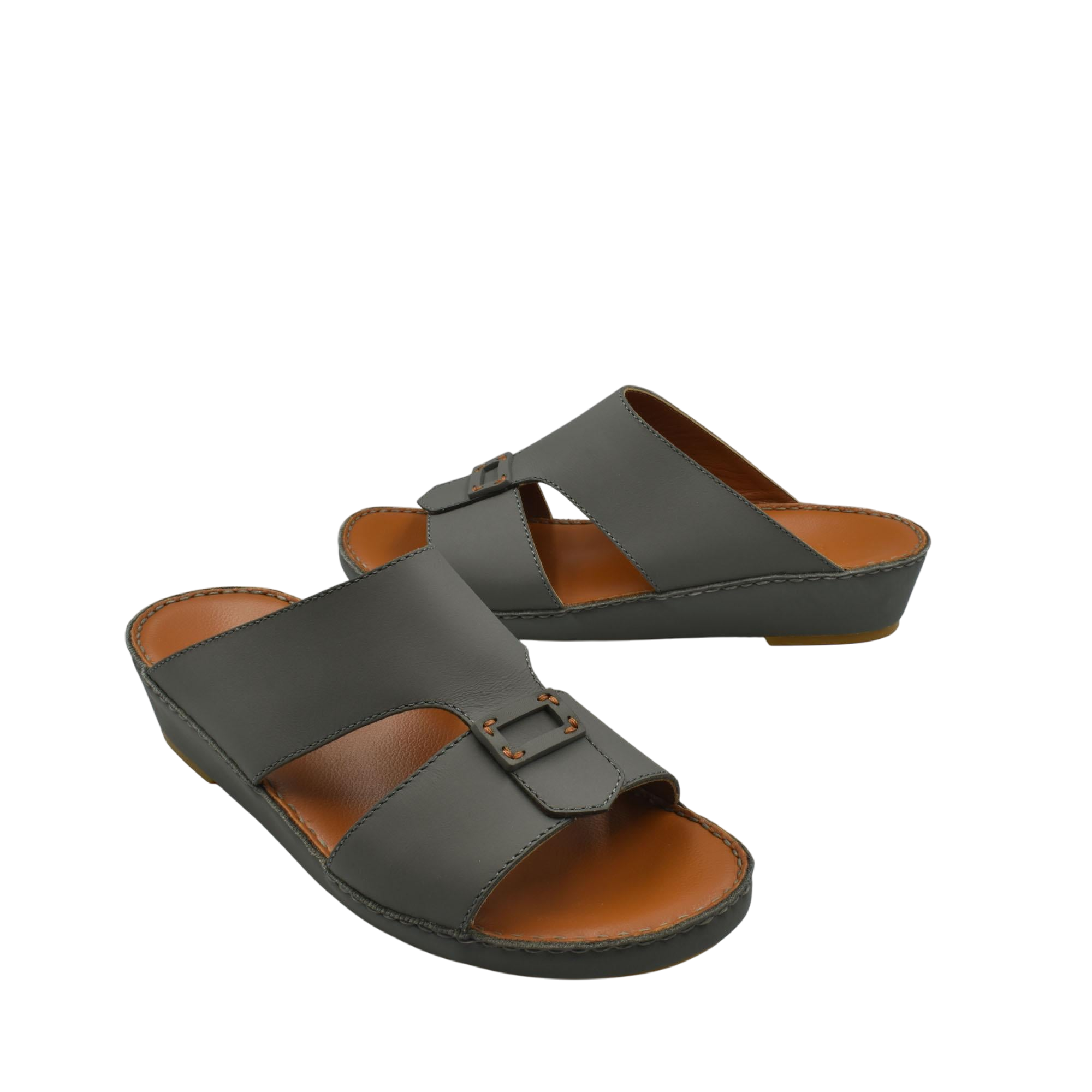 Black Italian leather sandals with buckle detail and cushioned brown footbed from Private collection