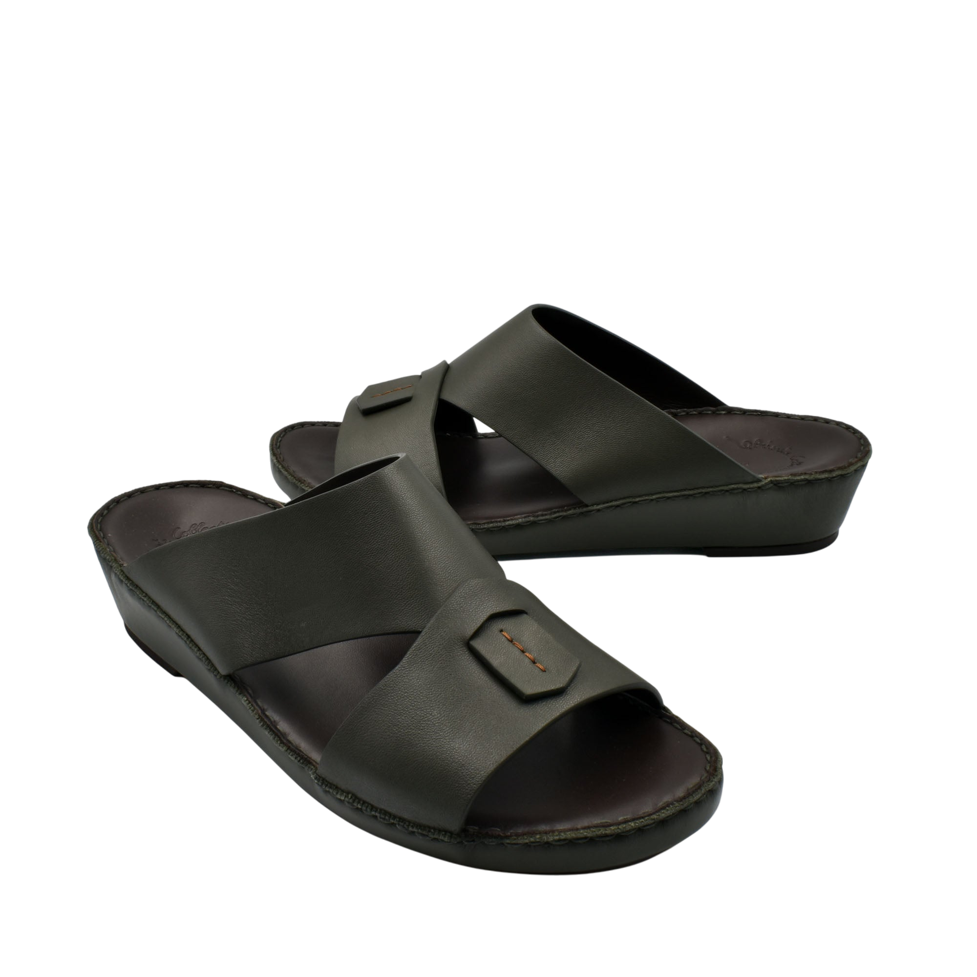 Black Italian nappa sandals with wide cross straps and cushioned footbed in slip-on style