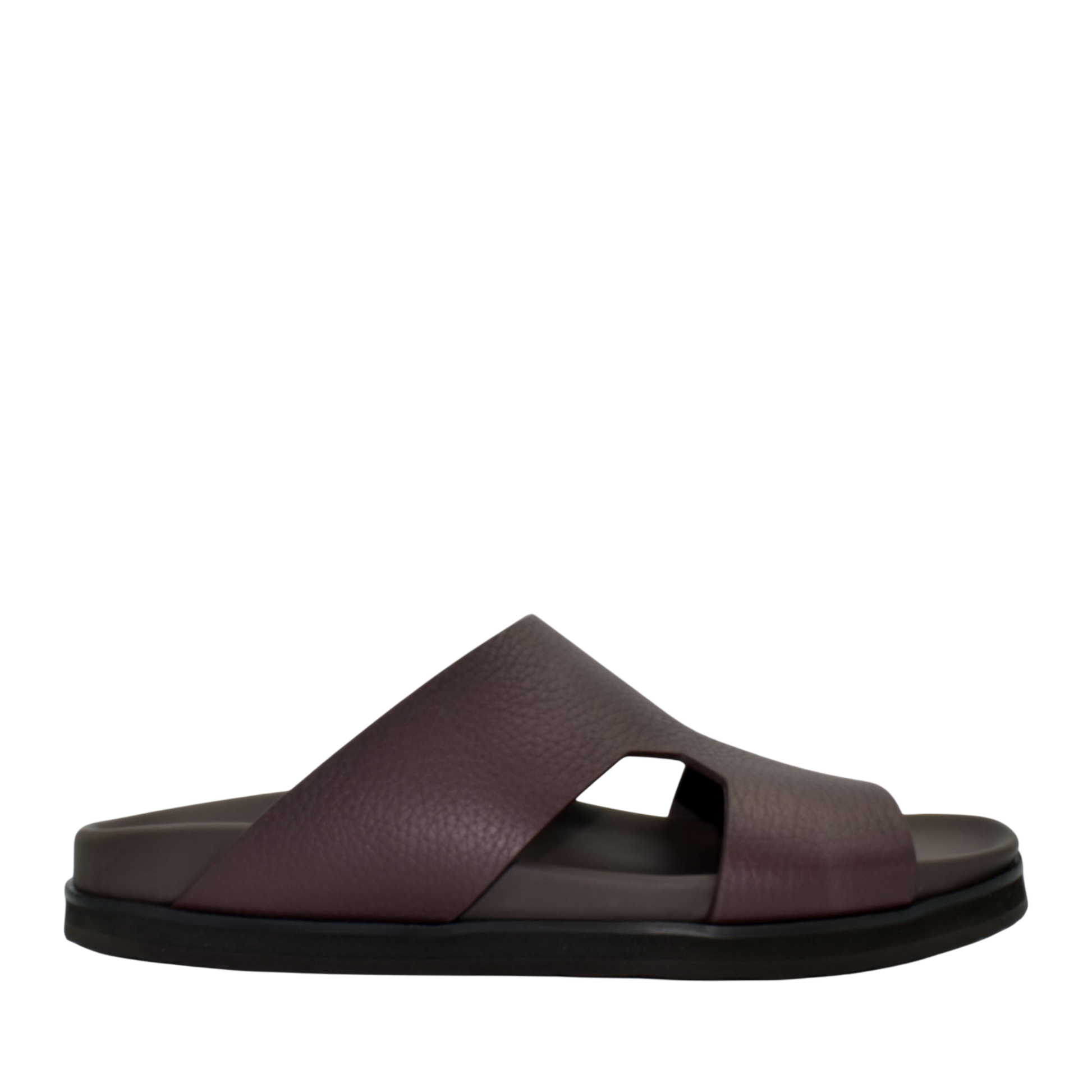 Side view of brown luxury leather sandals with wide straps and cushioned sole