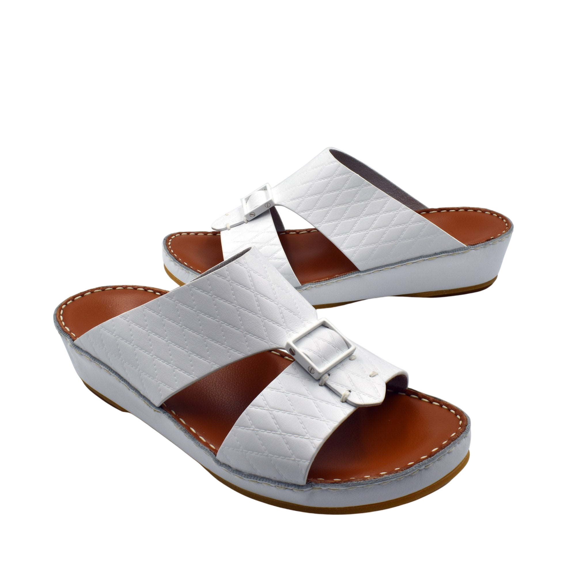 White luxury leather sandals with quilted straps and buckle detail on brown cushioned sole