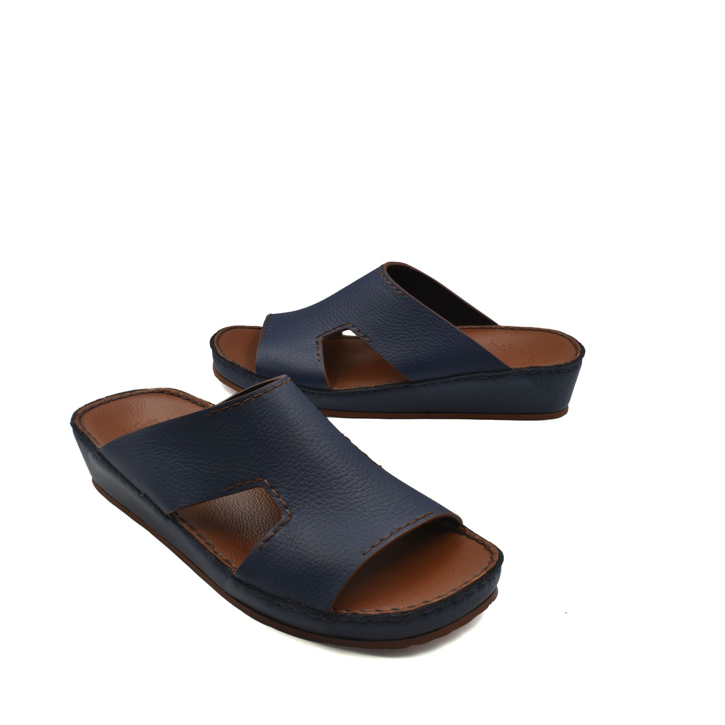 Pair of navy blue luxury leather slide sandals with cushioned sole and open toe design