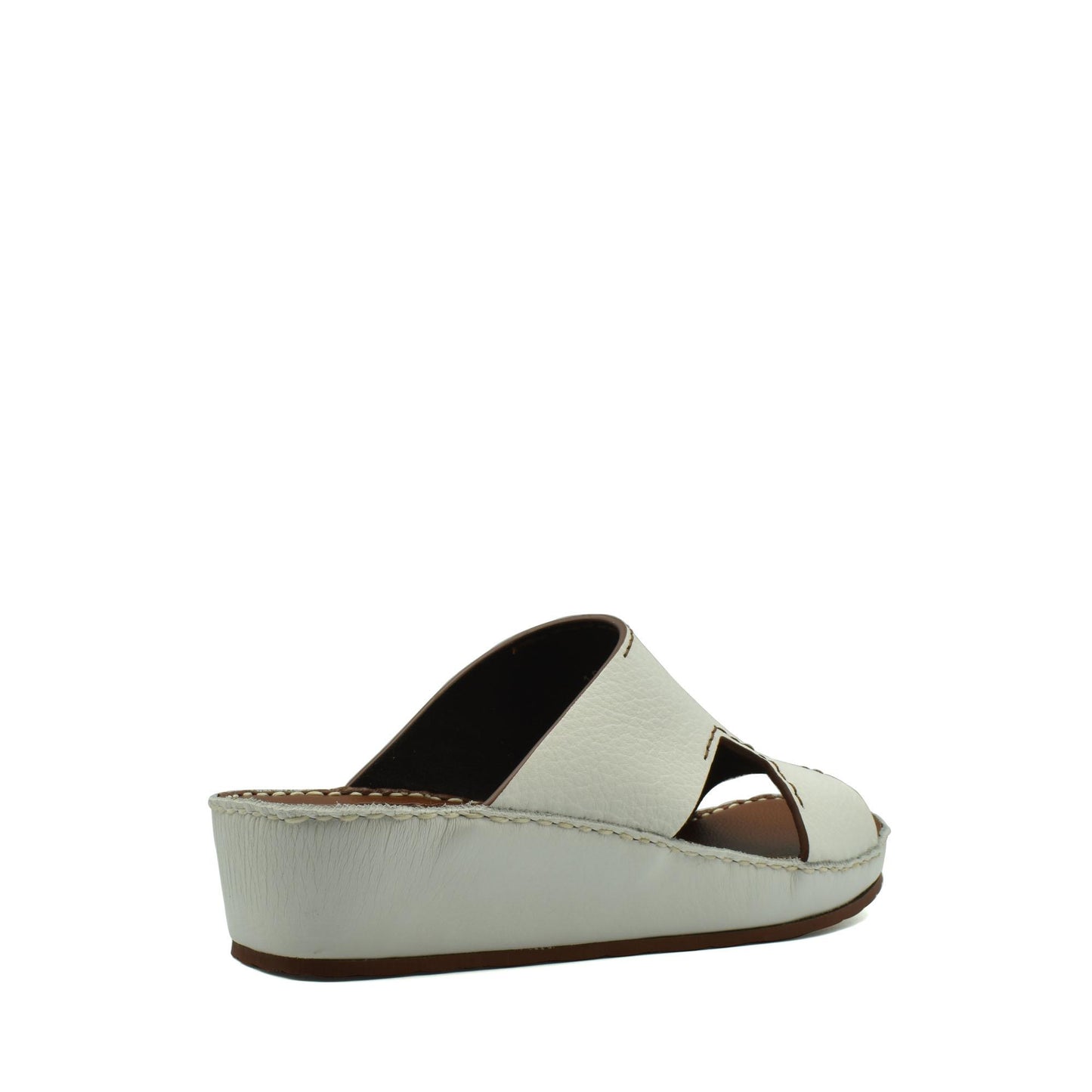 White luxury leather slide sandals with open toe and cushioned wedge sole