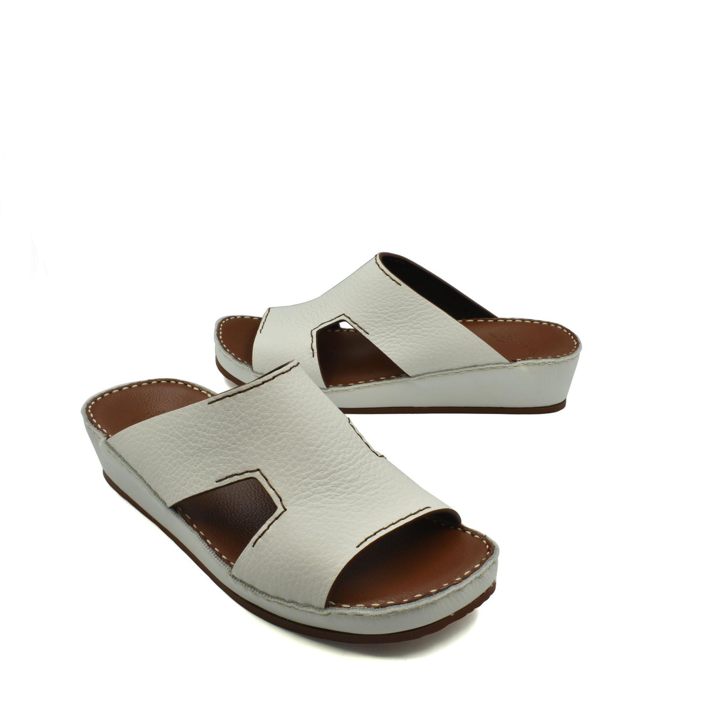 White luxury leather slide sandals with open toe and cushioned sole from private collection