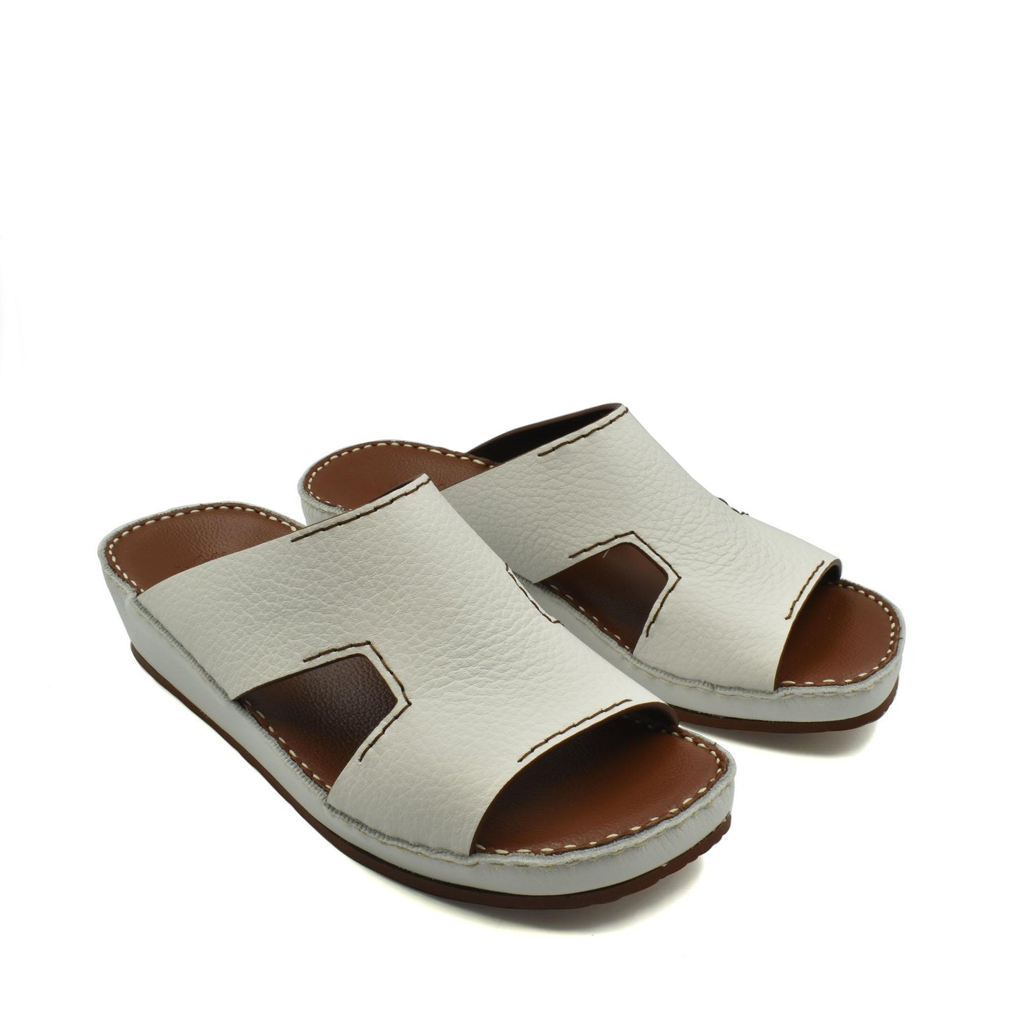 White luxury leather slide sandals with open toe and stitched detailing for comfortable wear