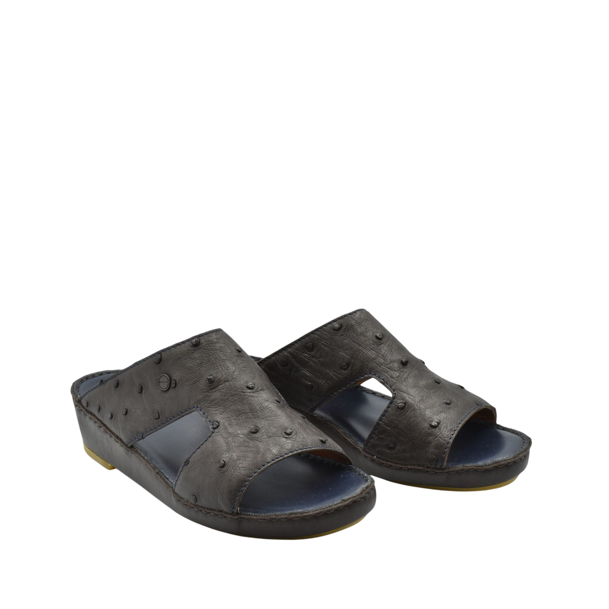 Pair of black luxury ostrich sandals with open toe and textured leather design