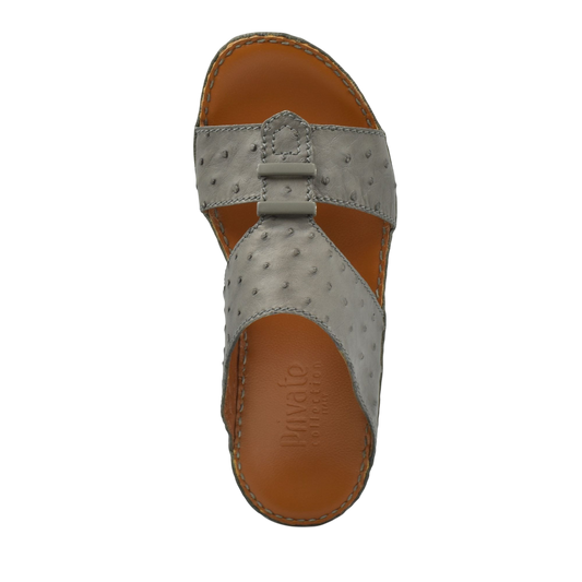 Top view of luxury ostrich sandals in gray with tan leather sole and detailed stitching