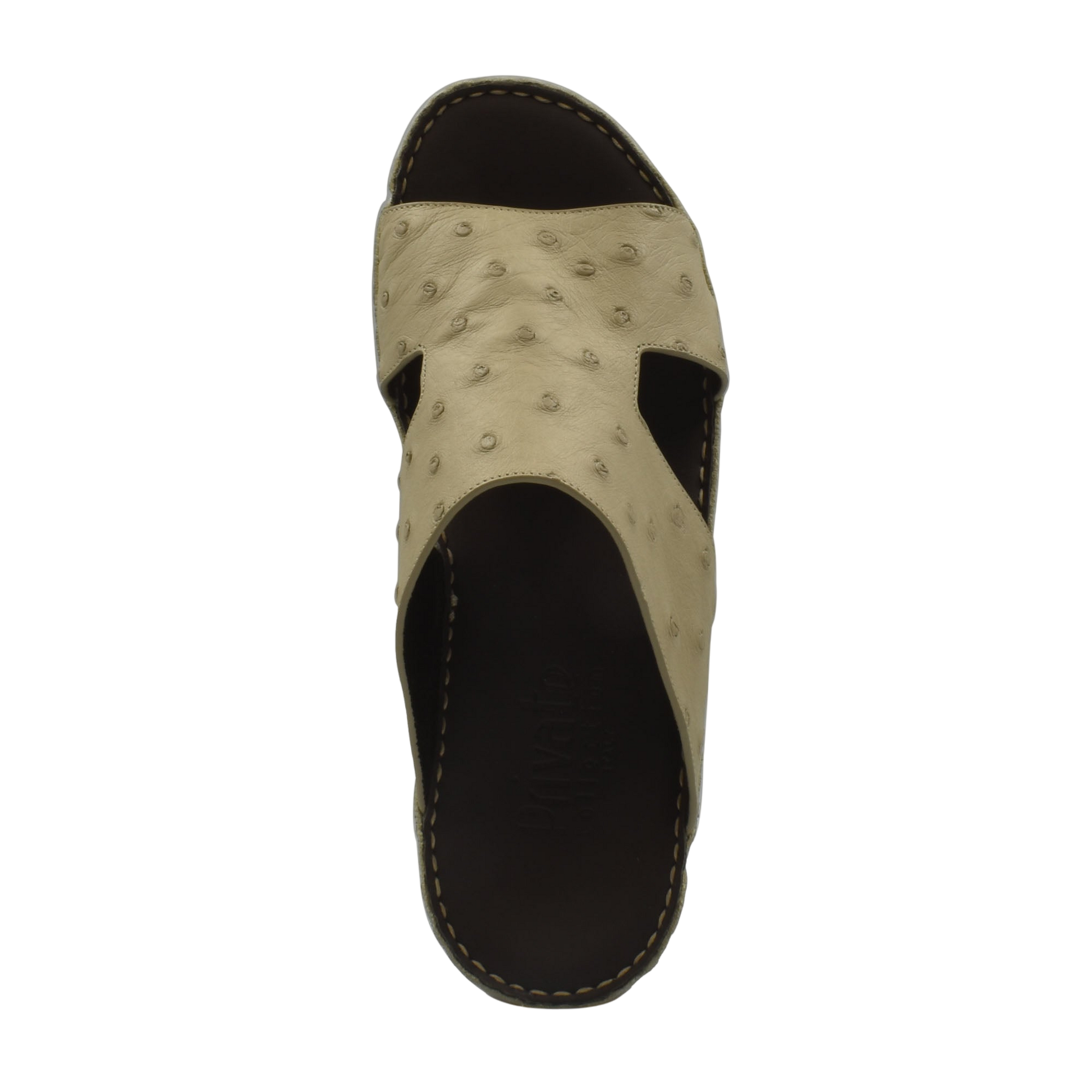 Top view of beige luxury ostrich sandals with textured leather and black sole