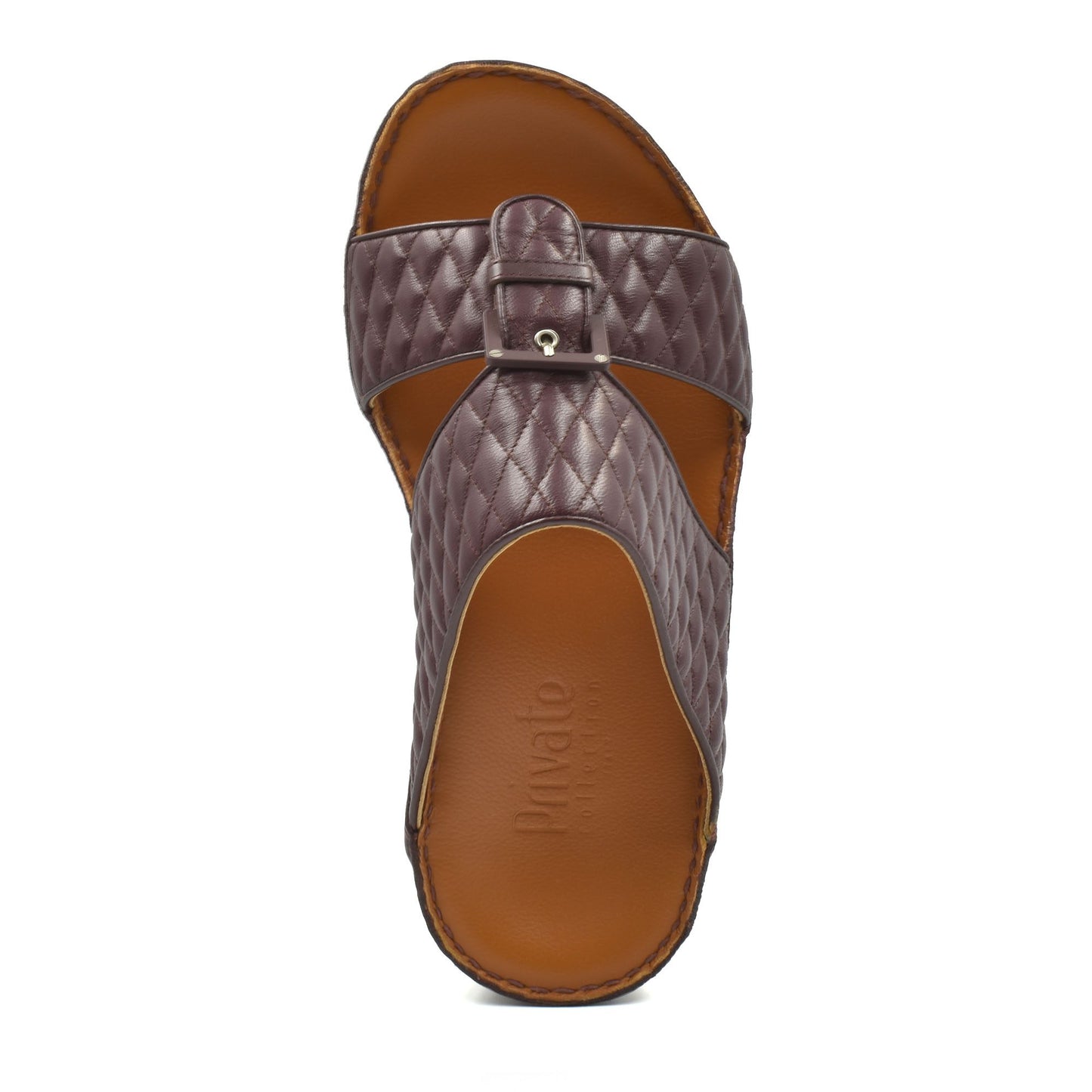 Top view of brown quilted leather luxury slip-on footwear with buckle detail and cushioned sole