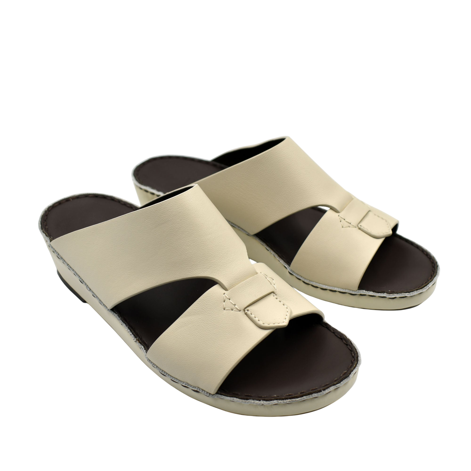 Beige Nappa leather sandals with cushioned black footbed and slip-on design for comfort