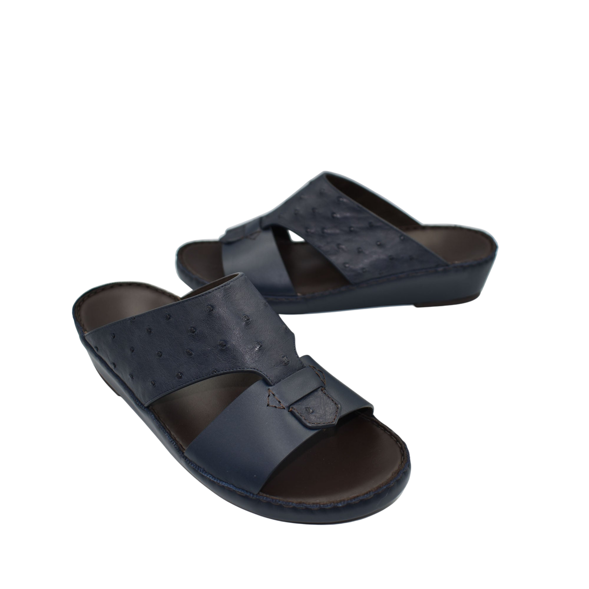 Black ostrich embossed slip on sandals with cushioned sole and open toe design