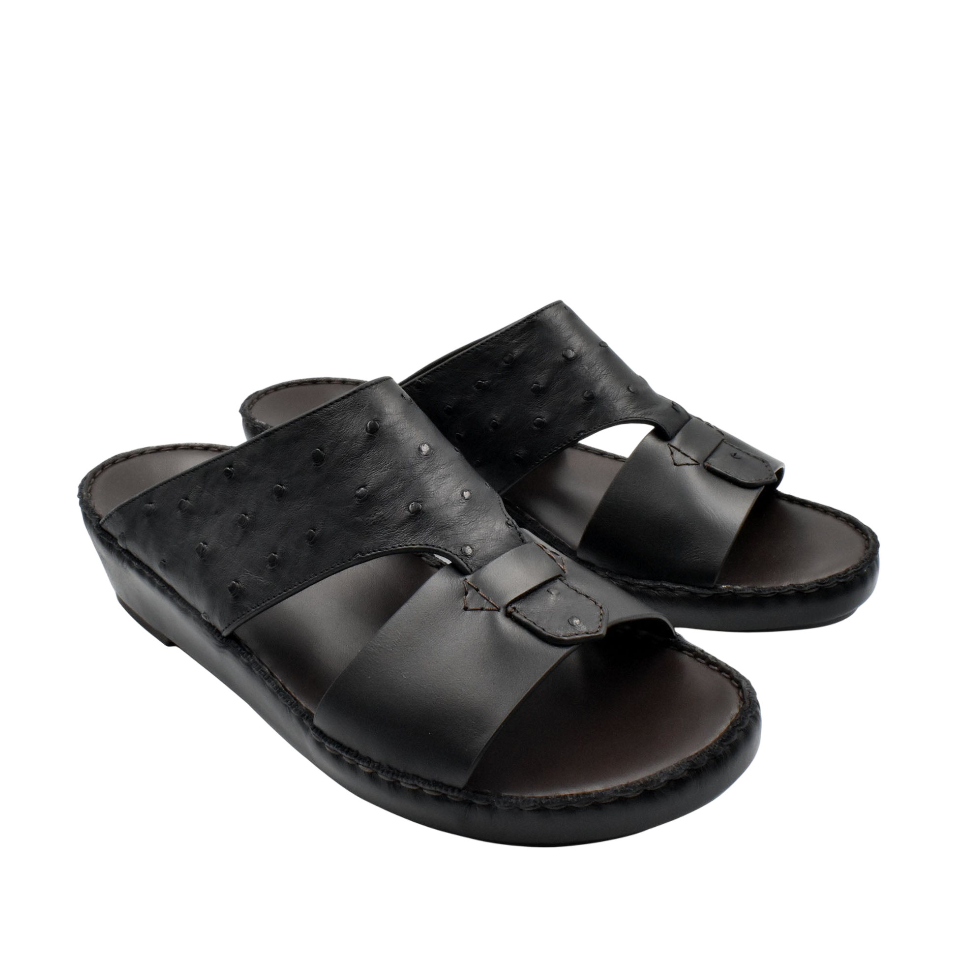 Black ostrich embossed slip on sandals with textured upper and cushioned sole from Private collection