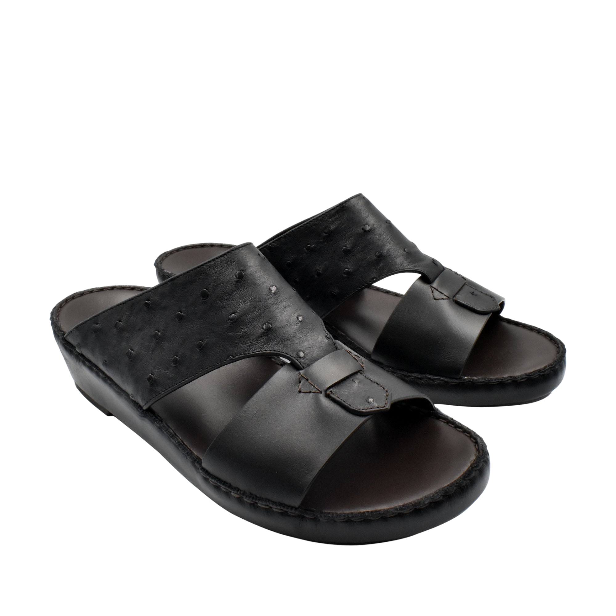 Black ostrich embossed slip on sandals with textured upper and cushioned sole from Private collection