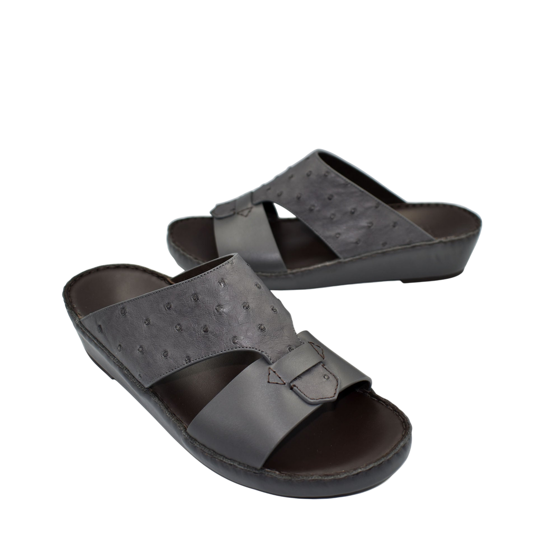 Black ostrich embossed slip on sandals with buckle detail and cushioned sole for comfortable wear