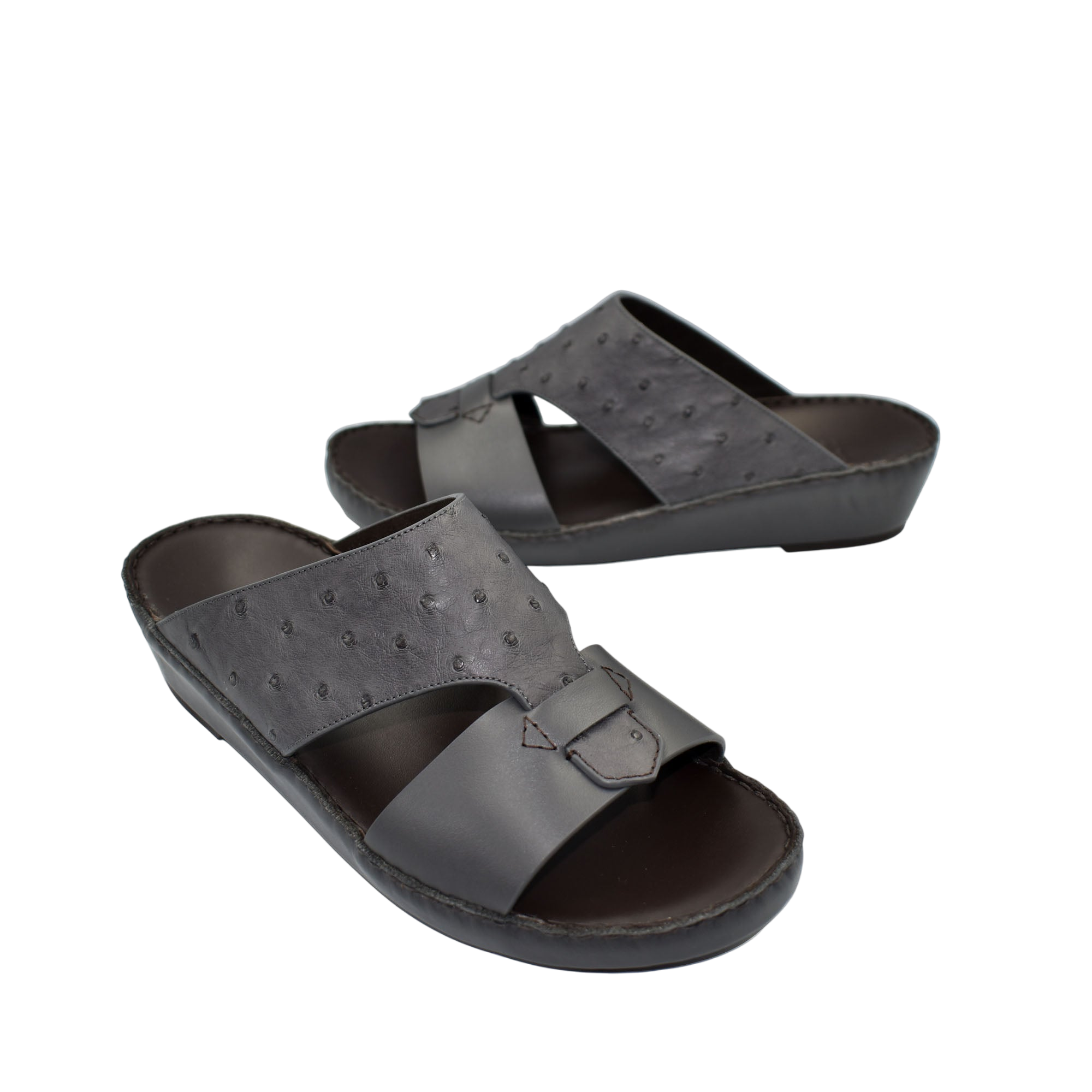 Black ostrich embossed slip on sandals with buckle detail and cushioned sole for comfortable wear