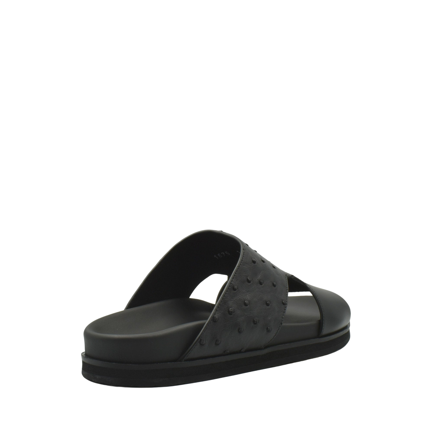 Black slide sandal featuring ostrich leather footwear with textured upper and cushioned sole