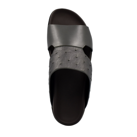 Top view of black ostrich leather footwear slide sandal with textured and smooth straps