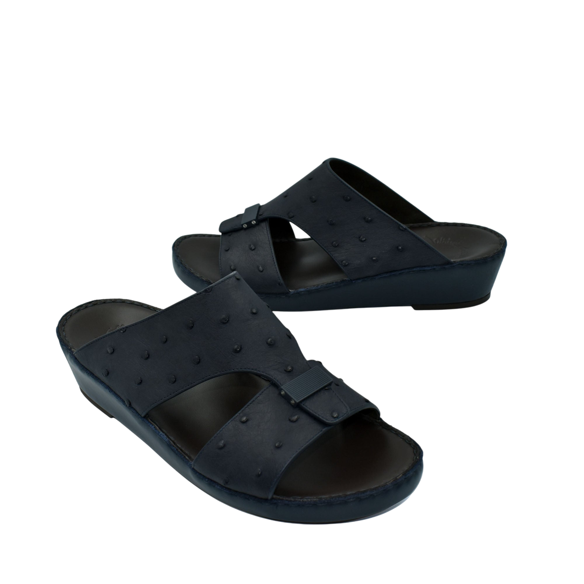 Black ostrich leather sandals with buckle detail and comfortable wedge sole