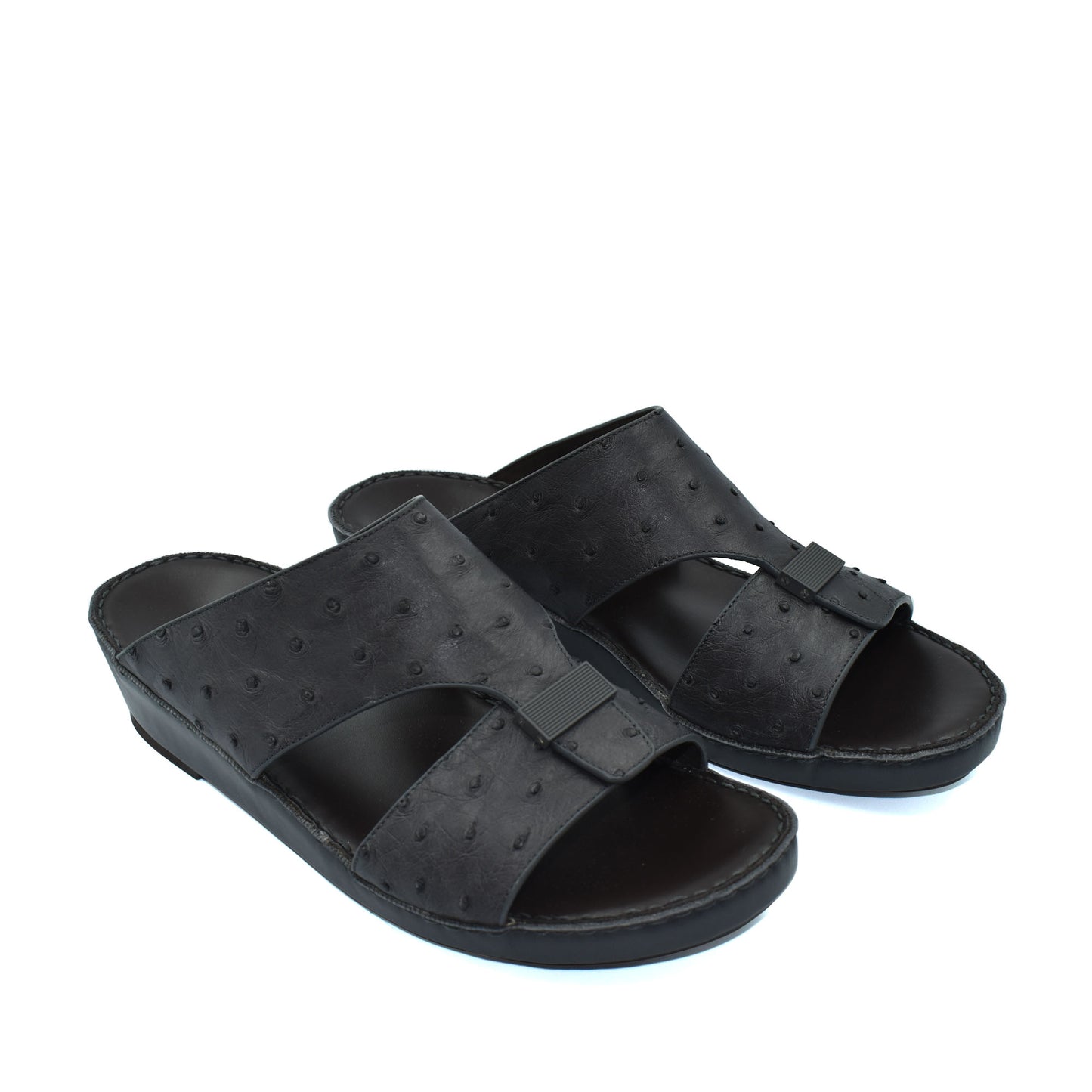 Black ostrich leather sandals with open toe and slip-on design for casual comfort