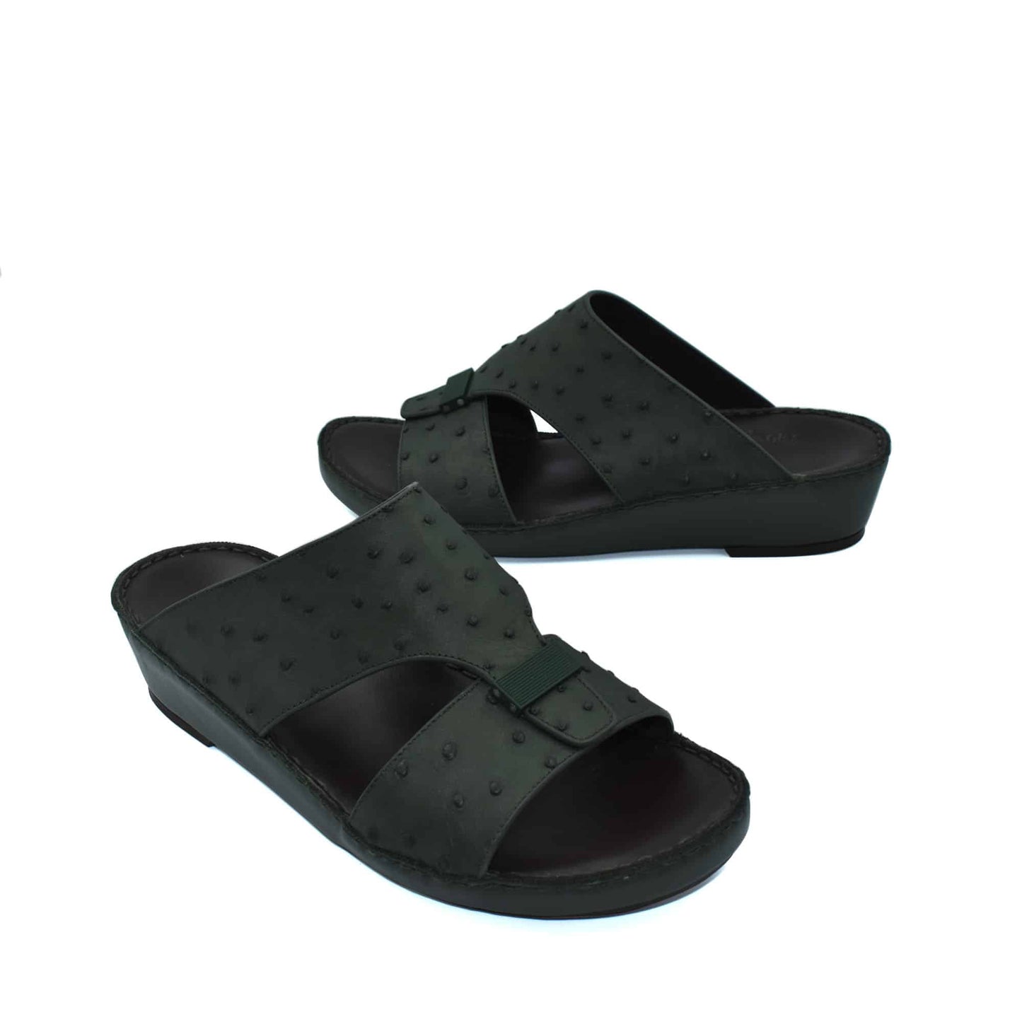 Black ostrich leather sandals with adjustable buckle straps and comfortable wedge sole