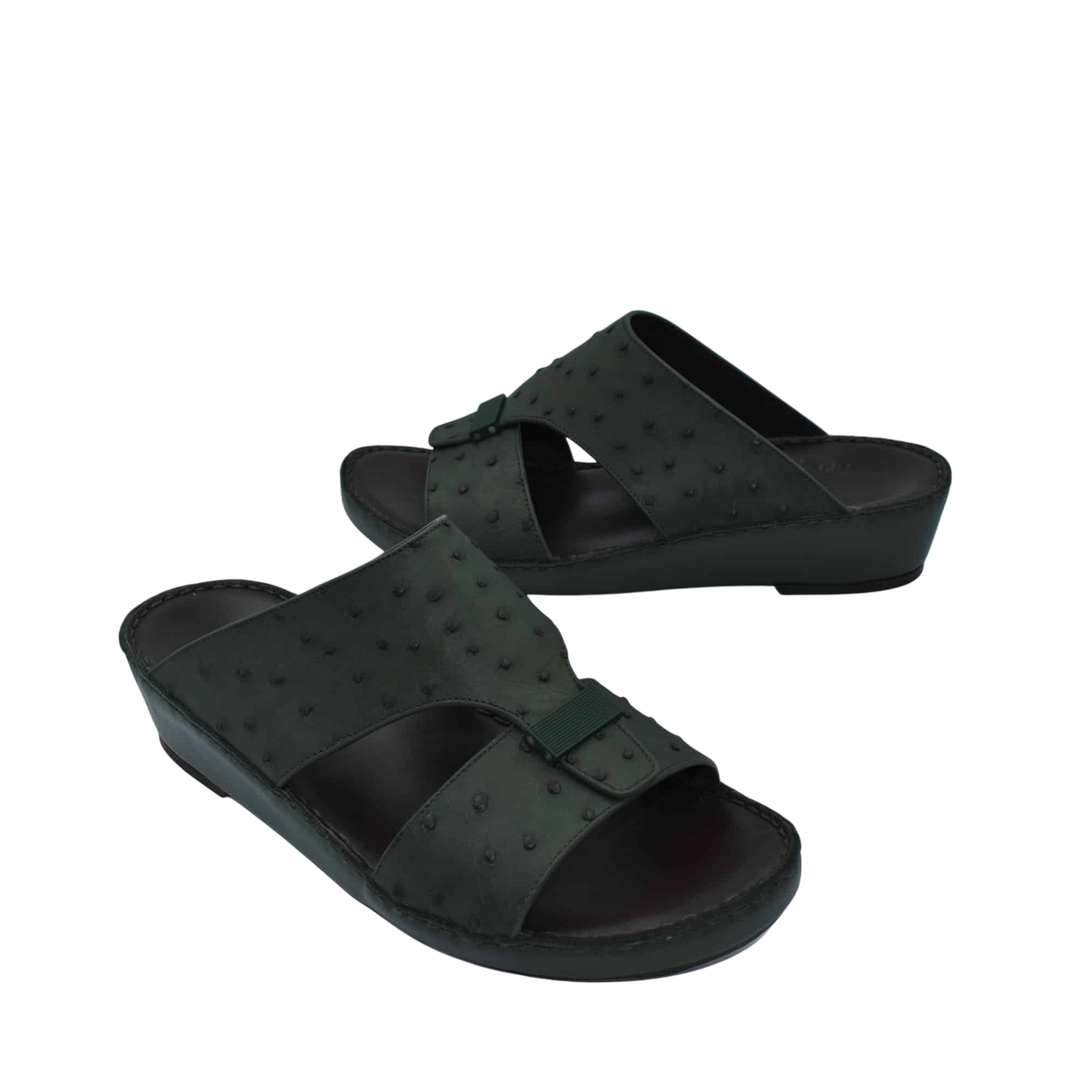 Black ostrich leather sandals with adjustable buckle straps and comfortable wedge sole