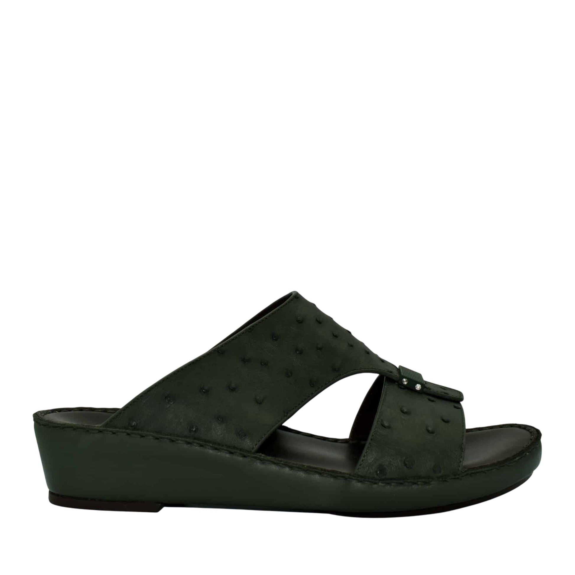 Black ostrich leather sandals with a wedge sole and open toe design from Private Collection