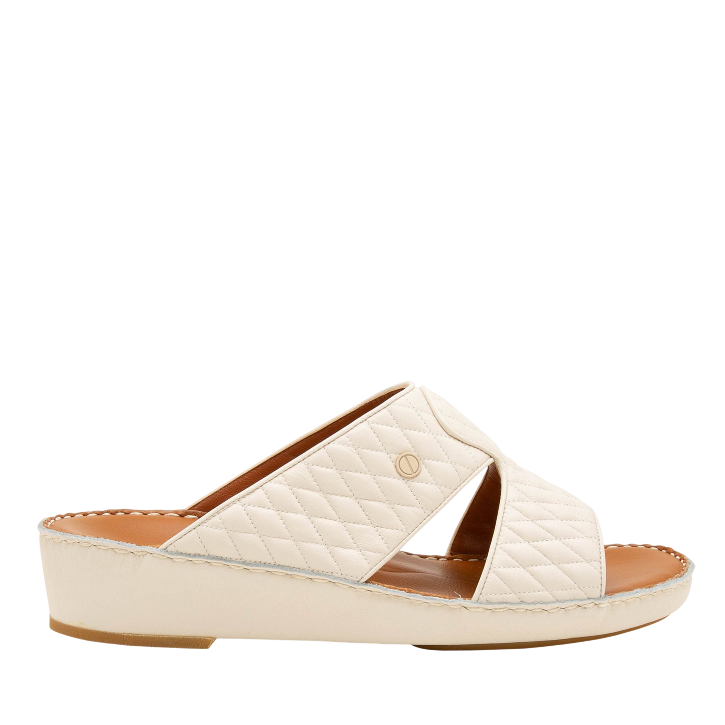 Cream-colored Peninsula Lamb Matelasse sandals with quilted design and open toe on wedge sole