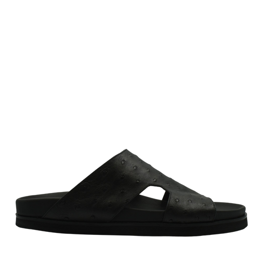 Black slide sandal made from premium ostrich leather footwear with textured upper and flat sole