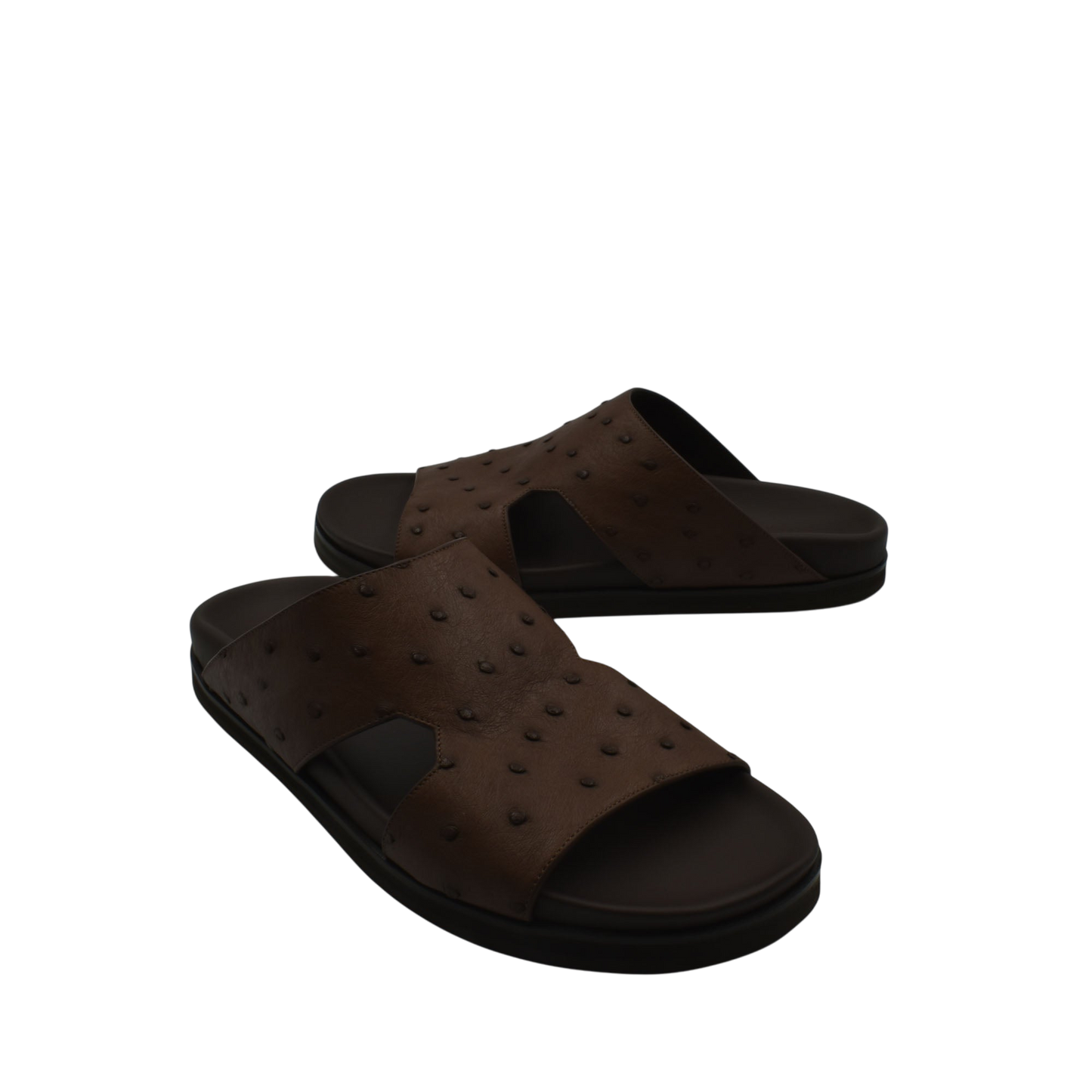 Brown slip-on sandals made of premium ostrich leather footwear with textured pattern and black sole