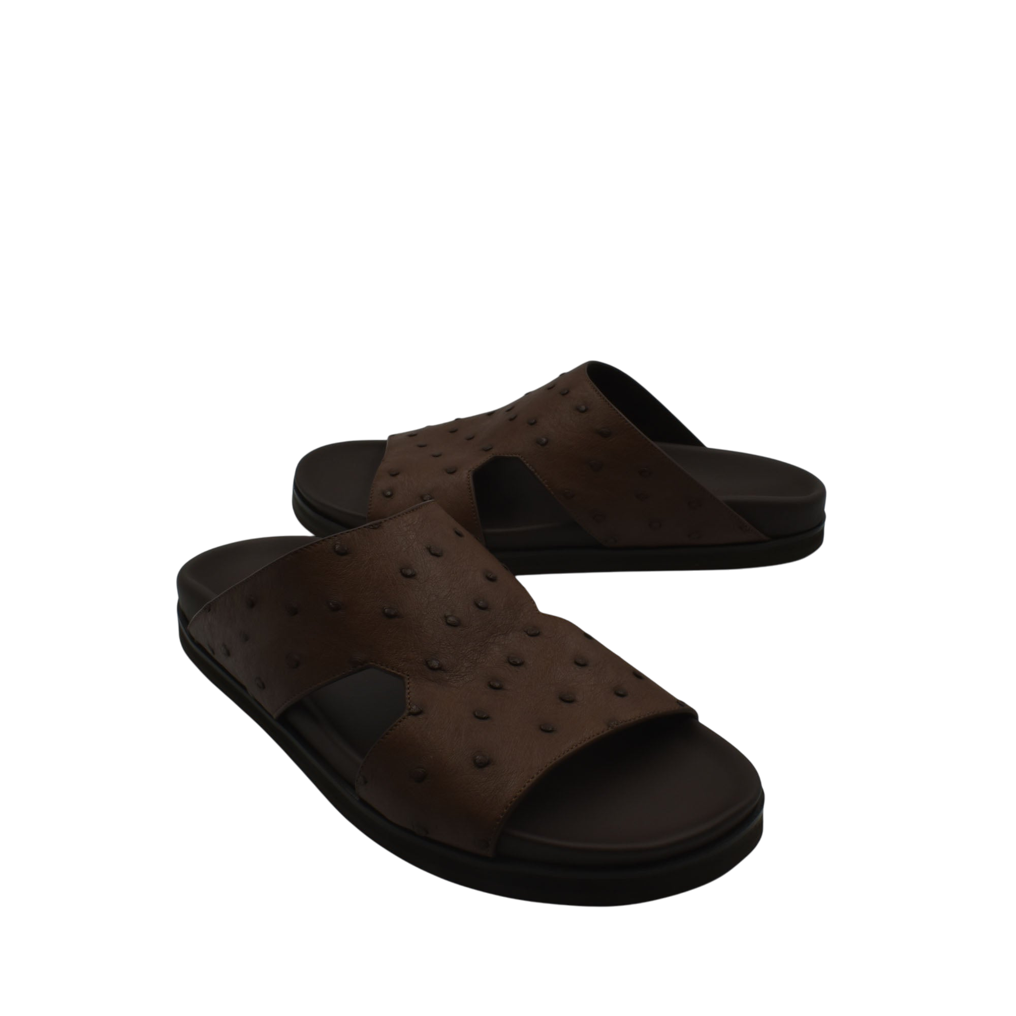 Brown slip-on sandals made of premium ostrich leather footwear with textured pattern and black sole