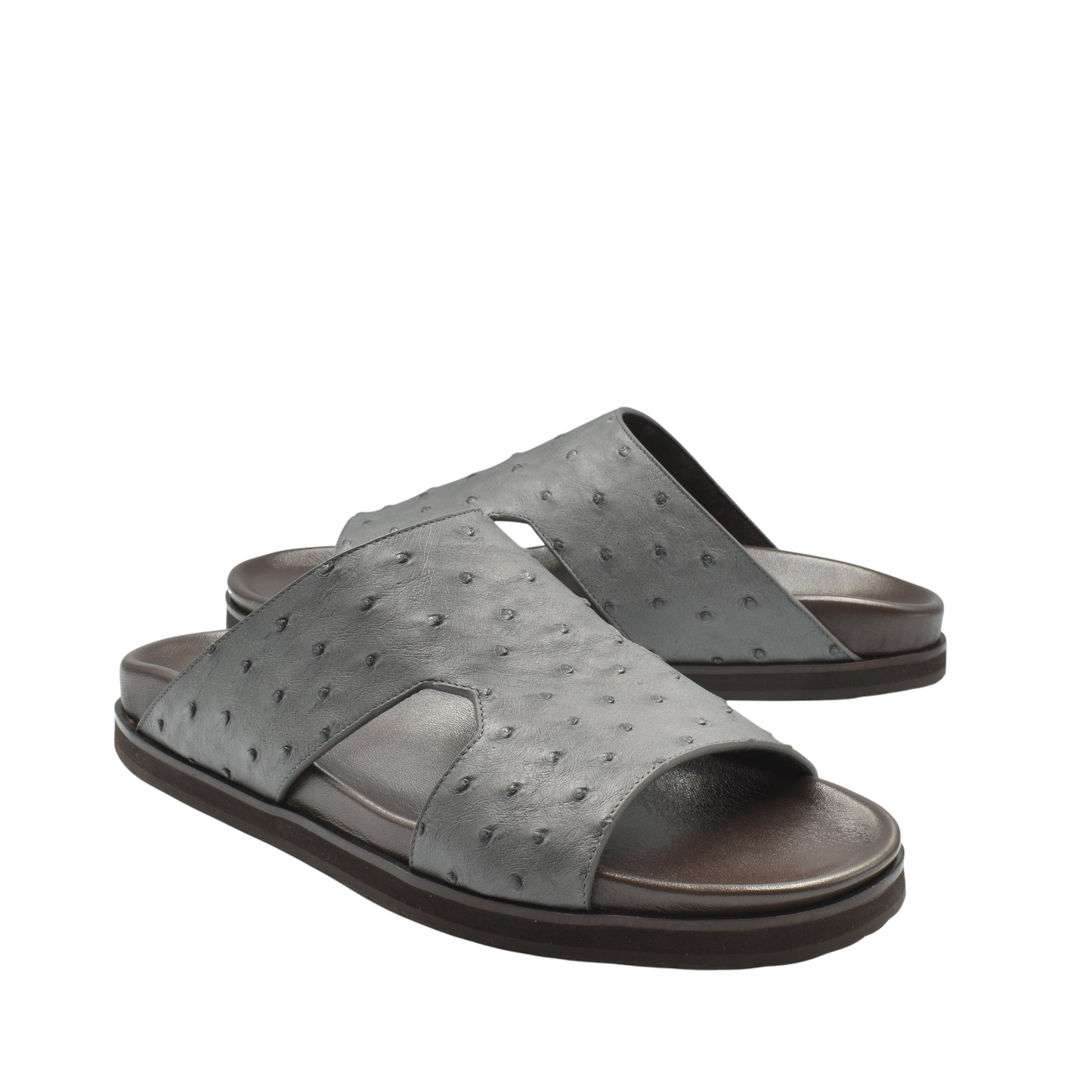 Gray slide sandals made from premium ostrich leather footwear with textured pattern and open toe design
