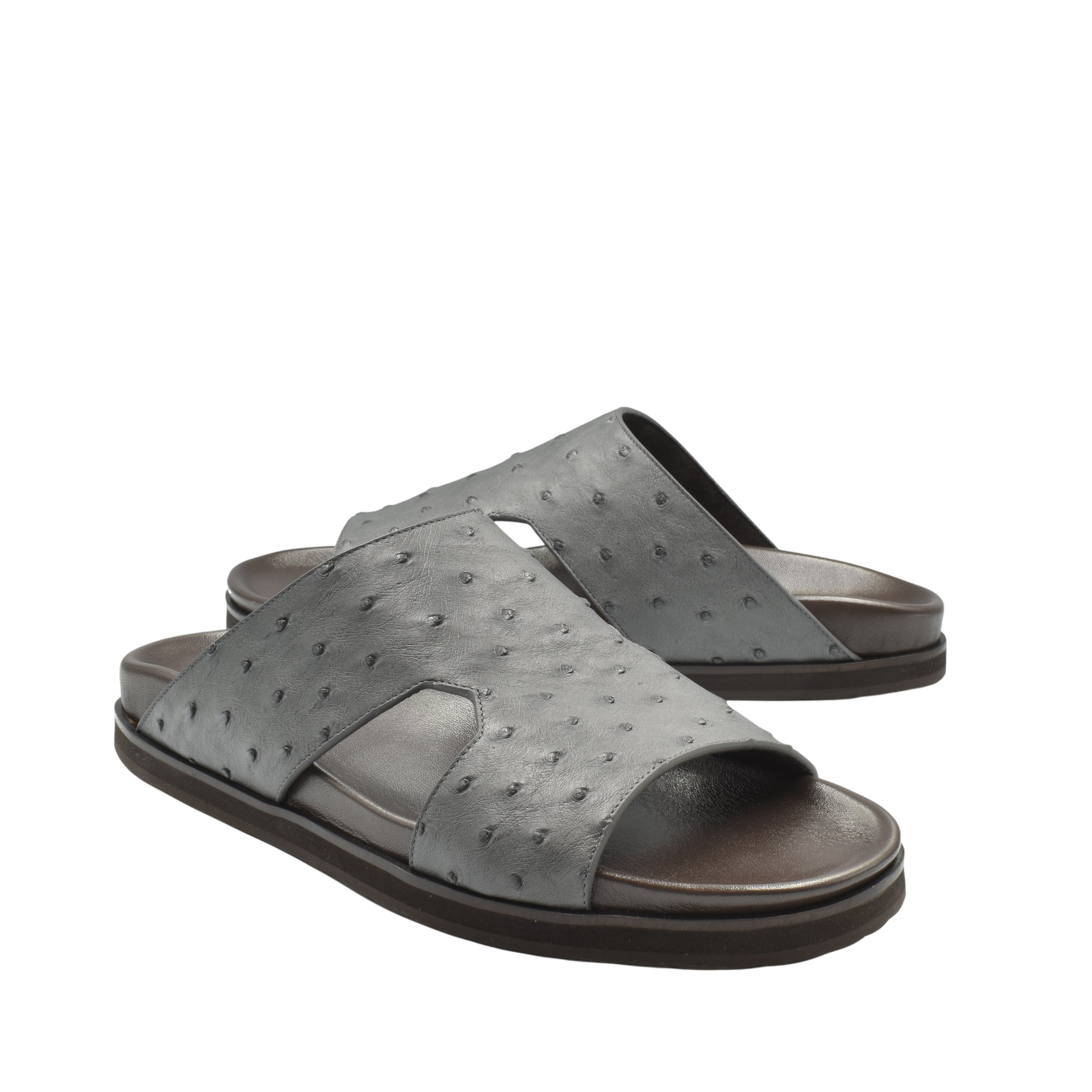 Gray slide sandals made from premium ostrich leather footwear with textured pattern and open toe design