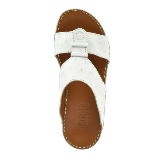 White ostrich leather sandals with brown cushioned footbed and stitched sole by Private Collection