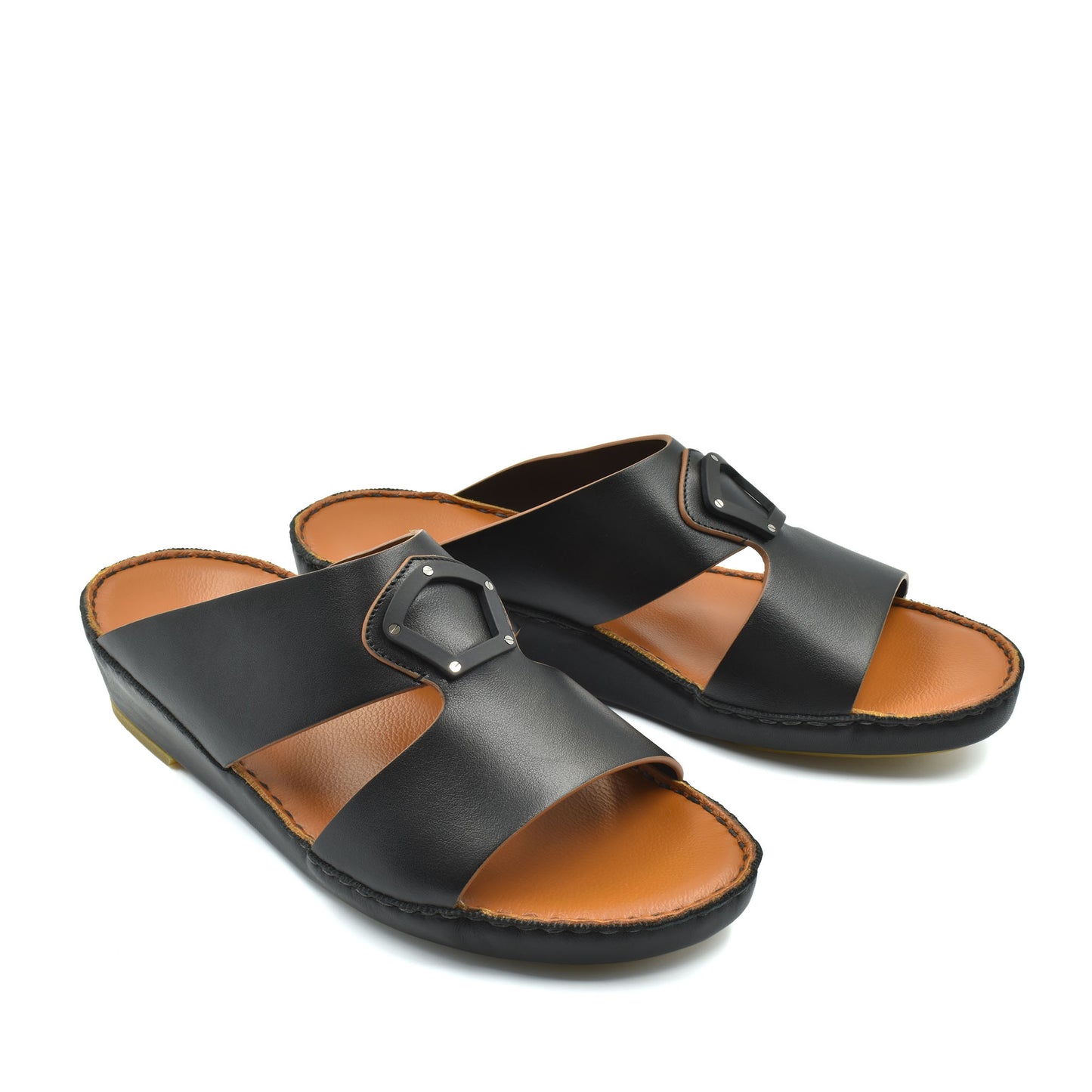 Black natural leather slide shoes with a buckle detail and tan cushioned footbed