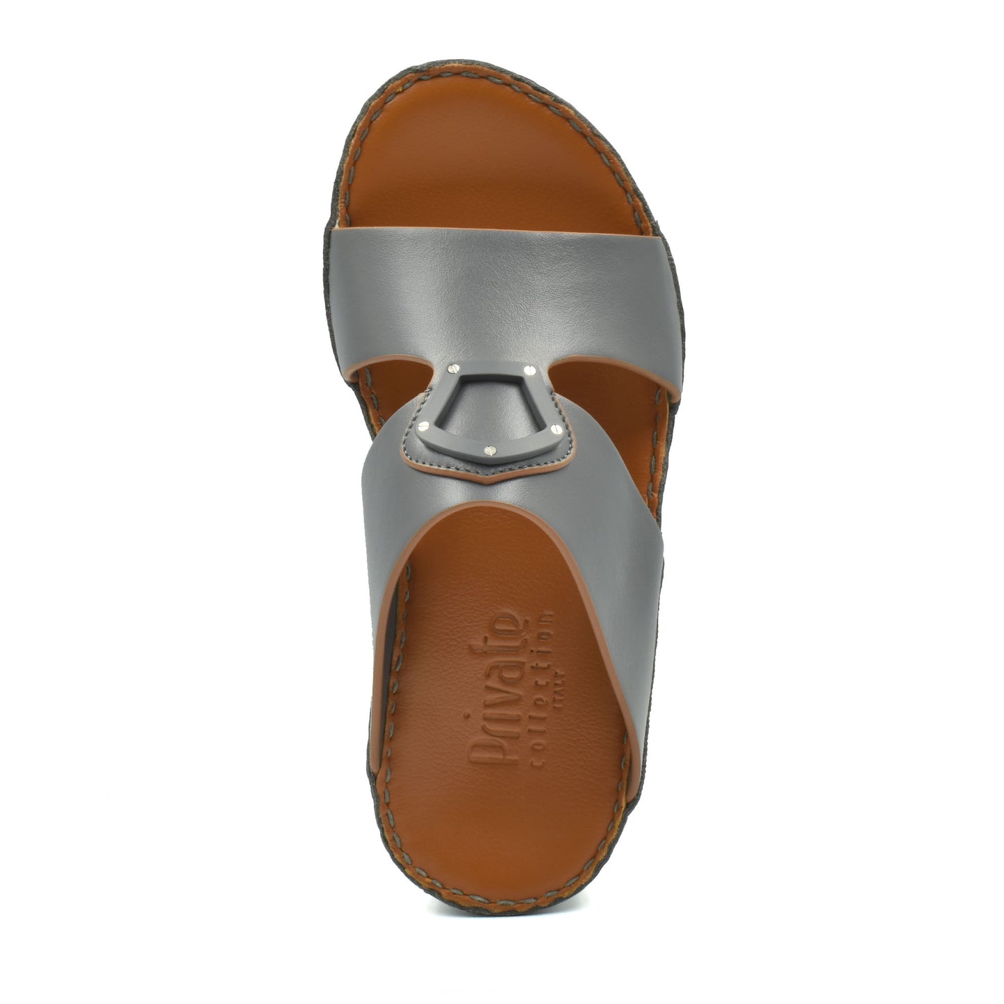 Top view of natural leather slide shoes in gray with brown footbed from Private collection