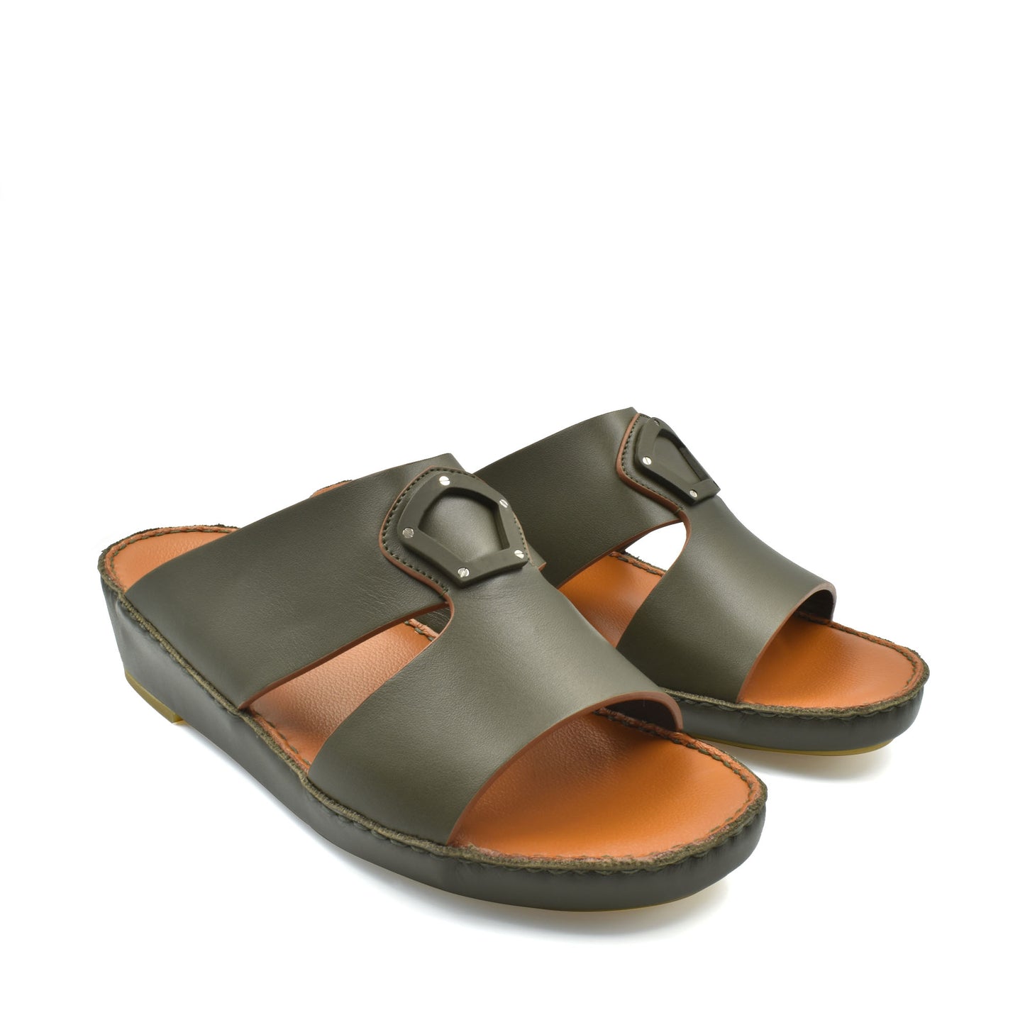 Pair of olive green natural leather slide shoes with cushioned tan footbed and stitched sole