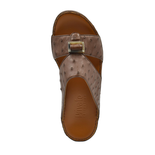 Brown ostrich leather sandals with a buckle design from Private Collection shown from a top view