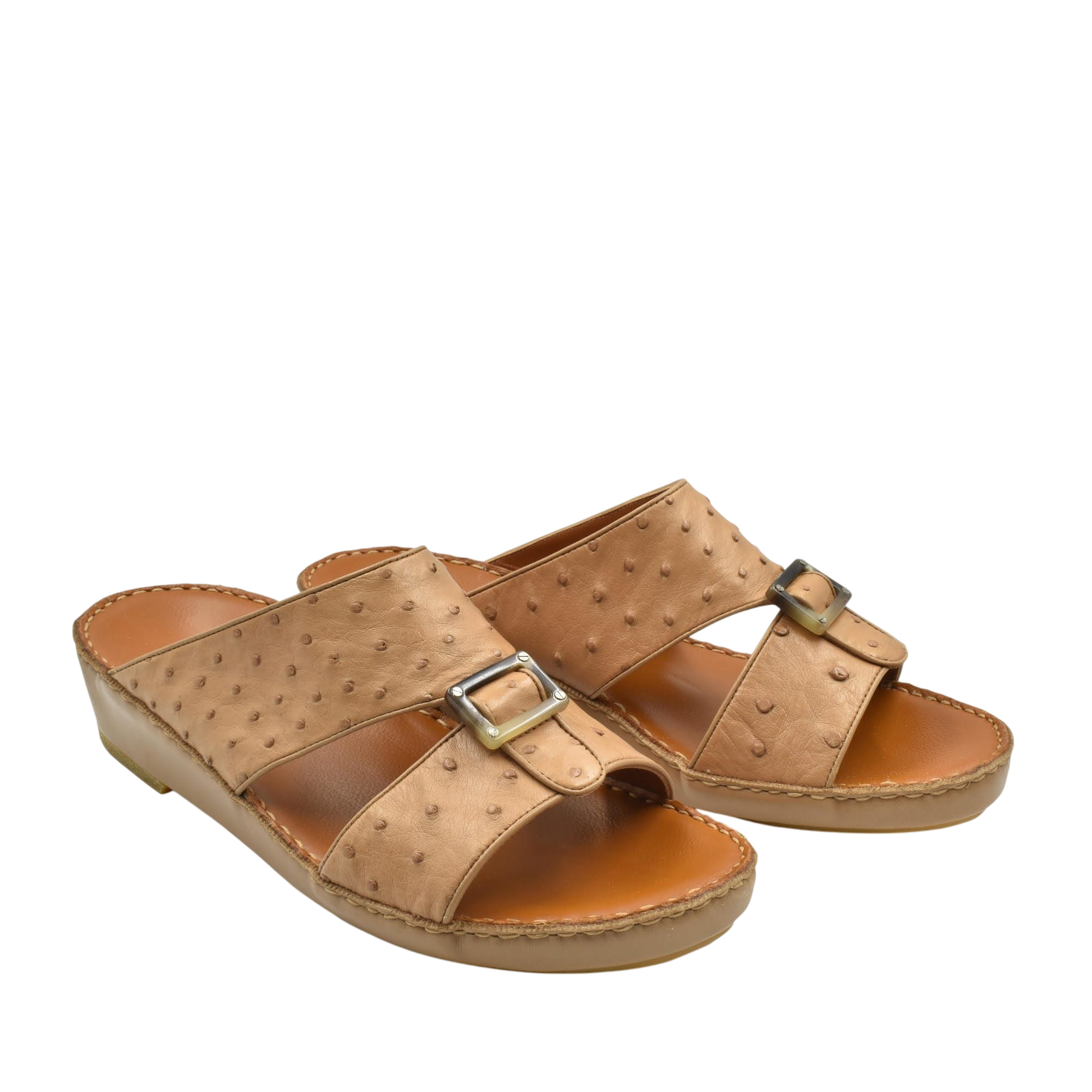 Tan ostrich leather sandals with buckle straps and cushioned soles for comfortable wear