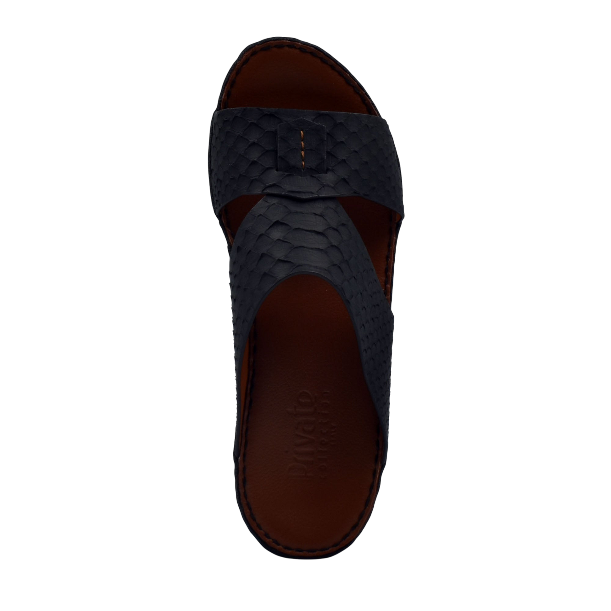 Top view of black rubber python shoes with textured pattern and brown cushioned insole