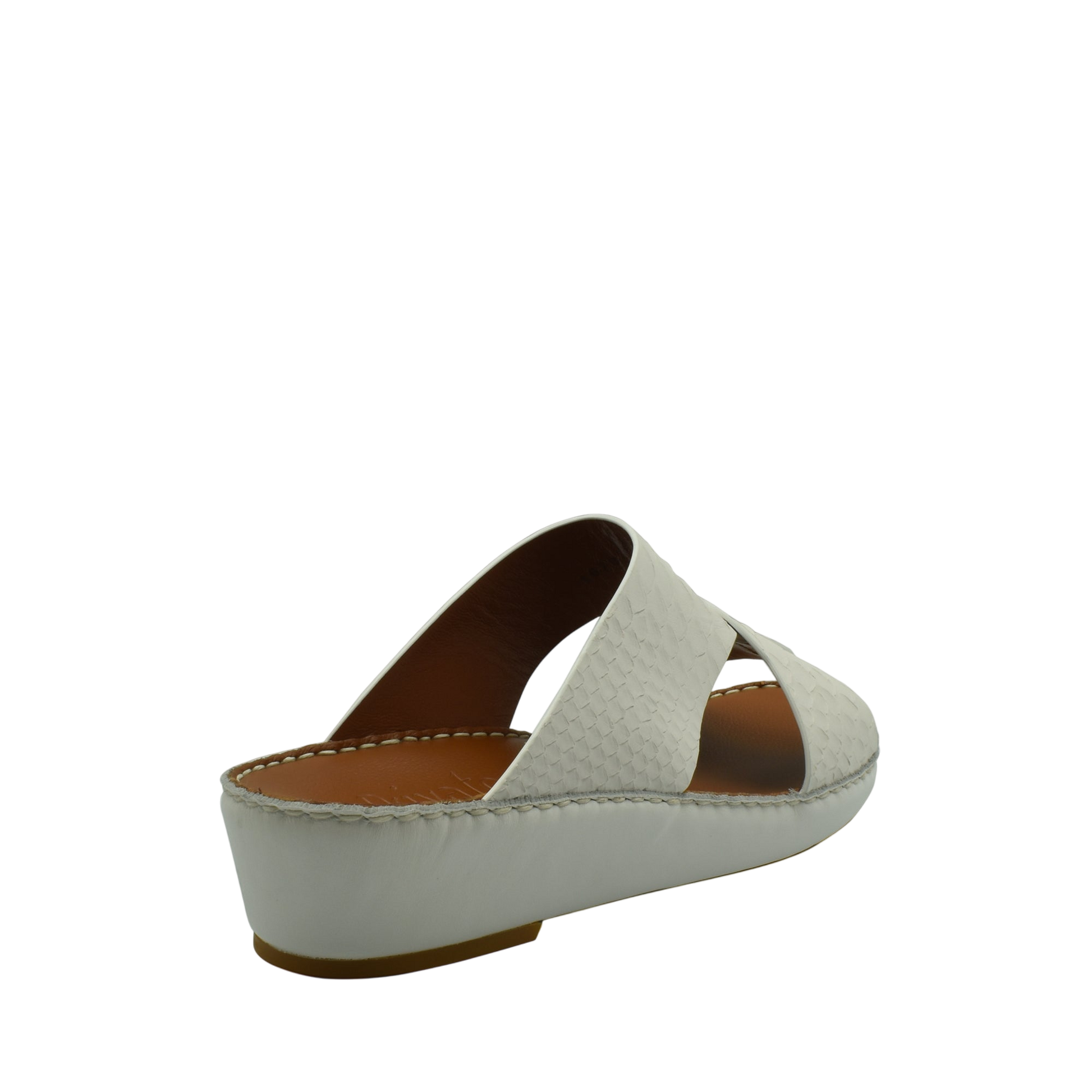 White slip-on rubber python shoes with a low wedge heel and textured upper from Private Collection