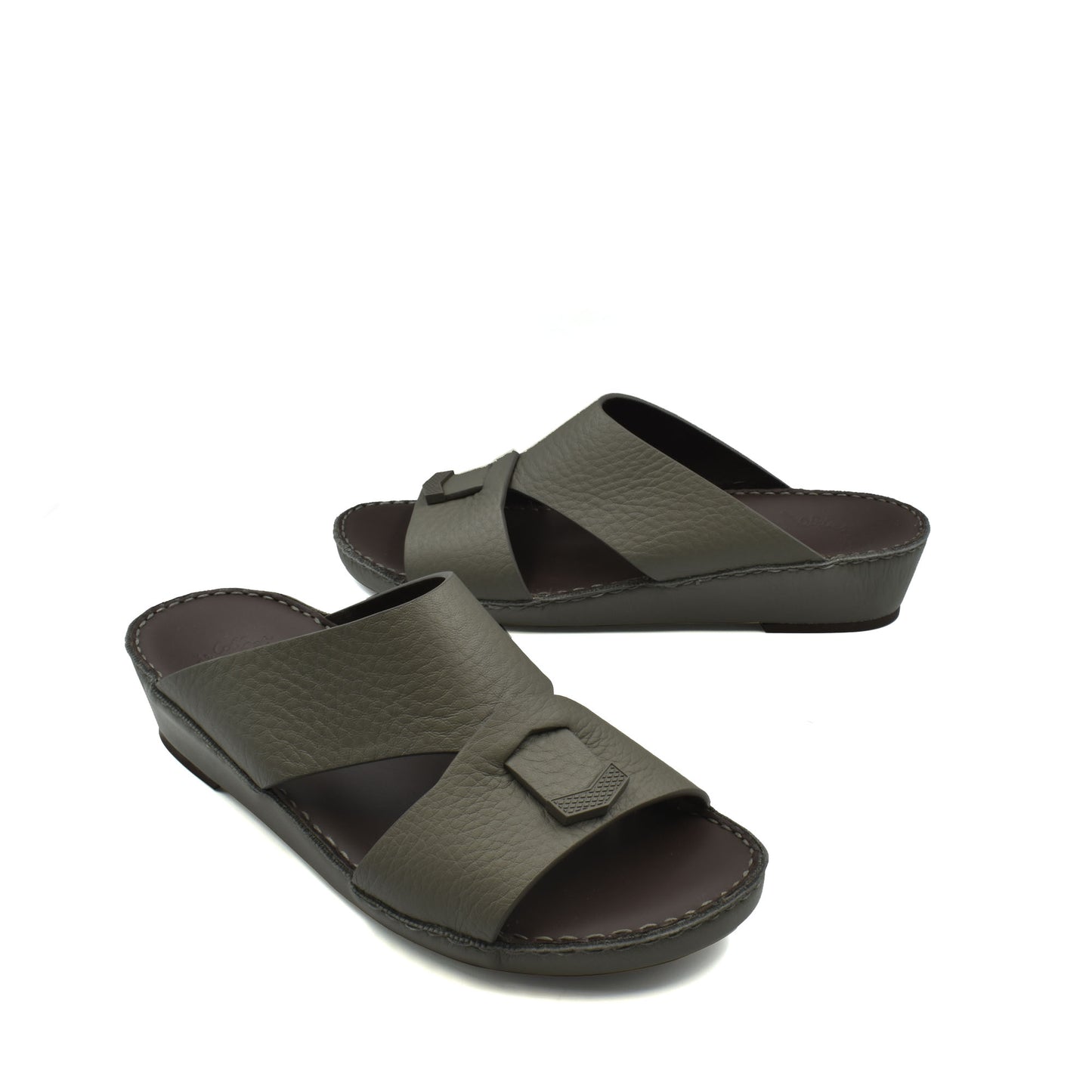 Trendy leather slide sandals in dark olive with a wide strap and decorative buckle detail