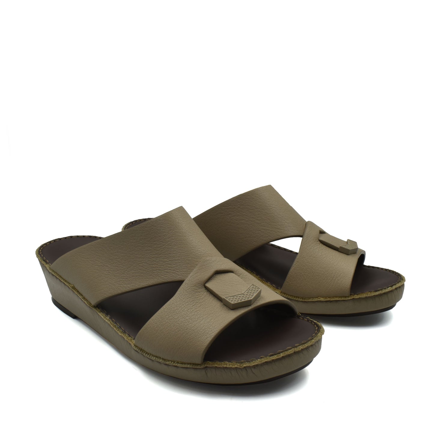 Trendy leather slide sandals in tan with wide straps and cushioned footbed for comfortable wear
