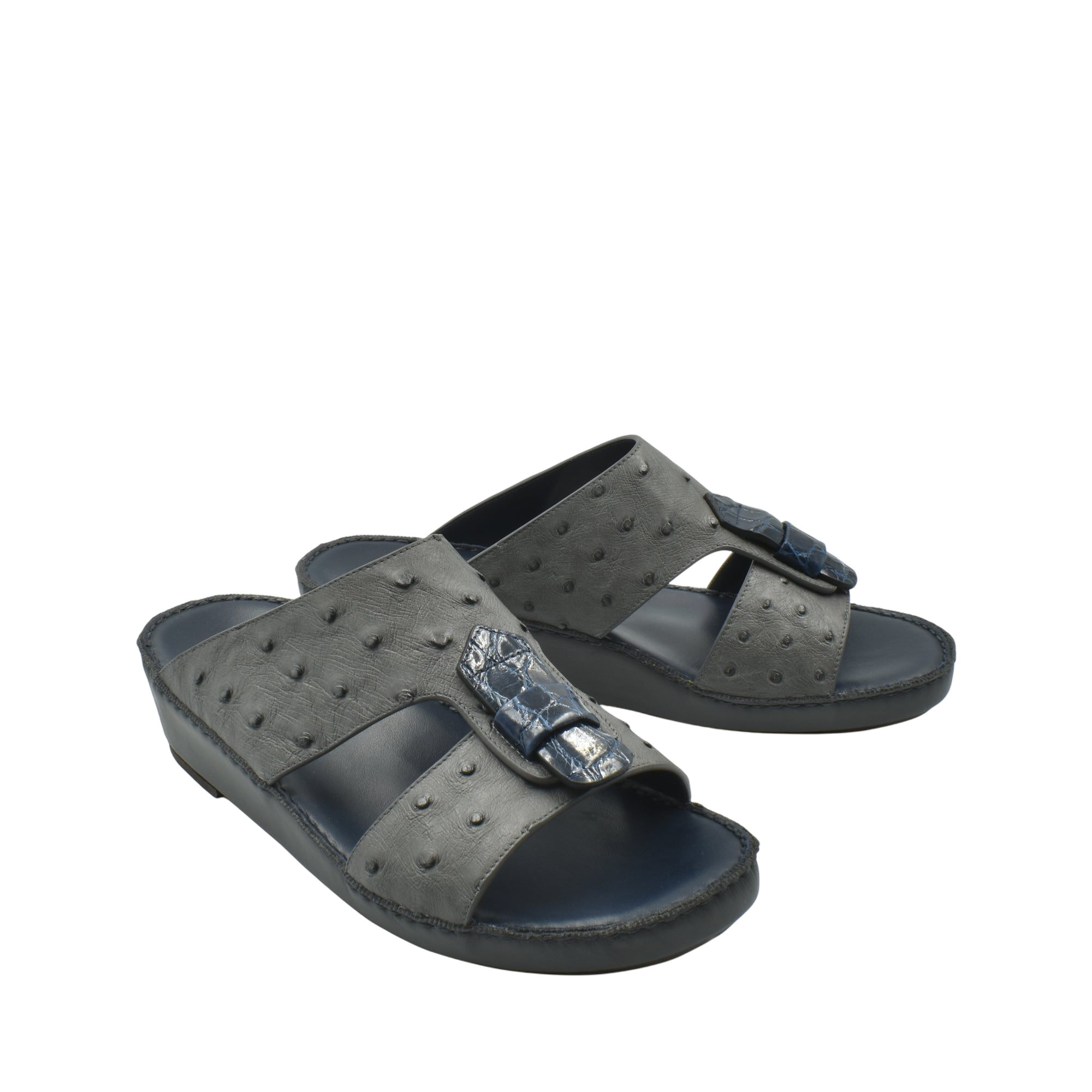 Black ostrich leather sandals with textured pattern and buckle detail from private collection