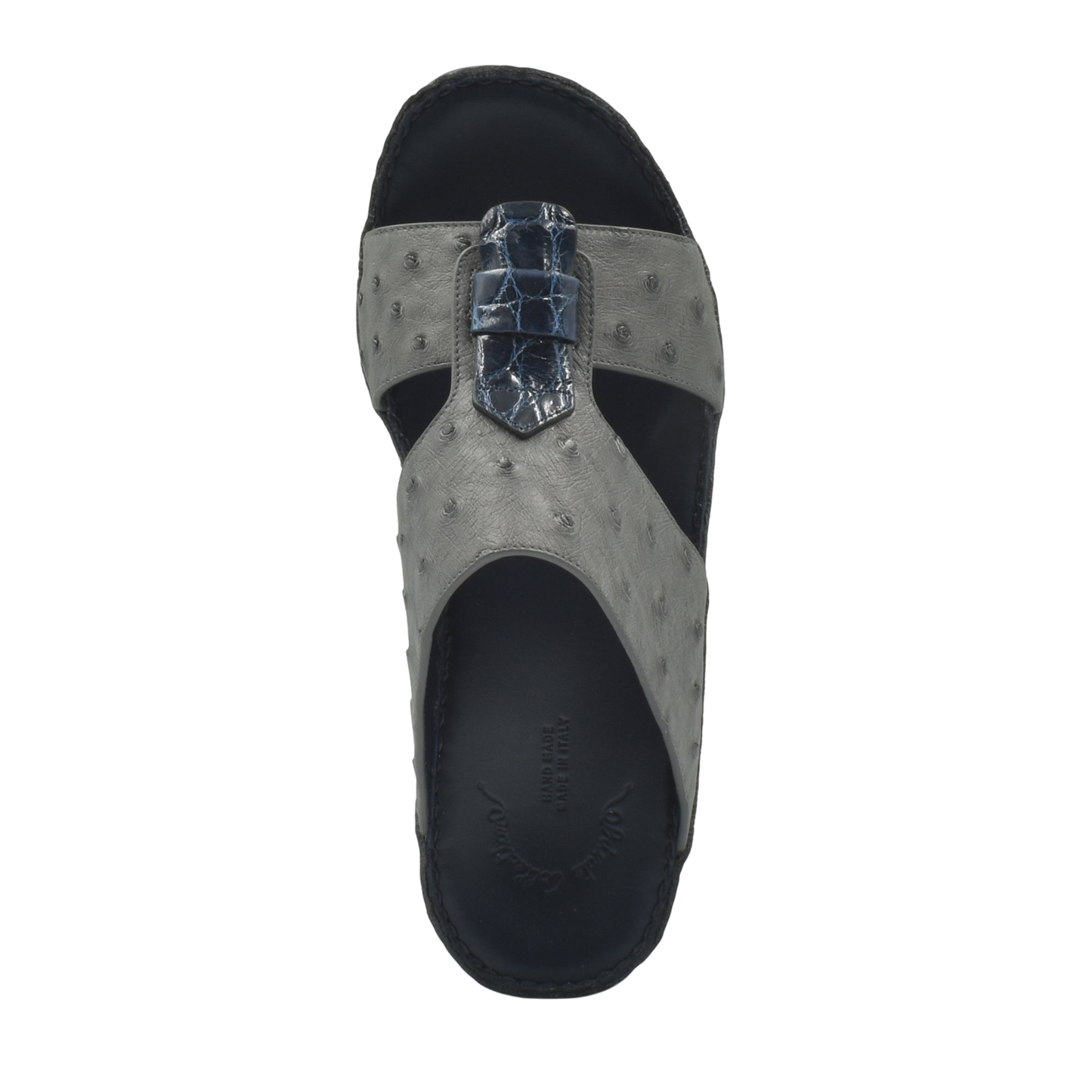 Top view of gray ostrich leather sandals with black sole and detailed strap design