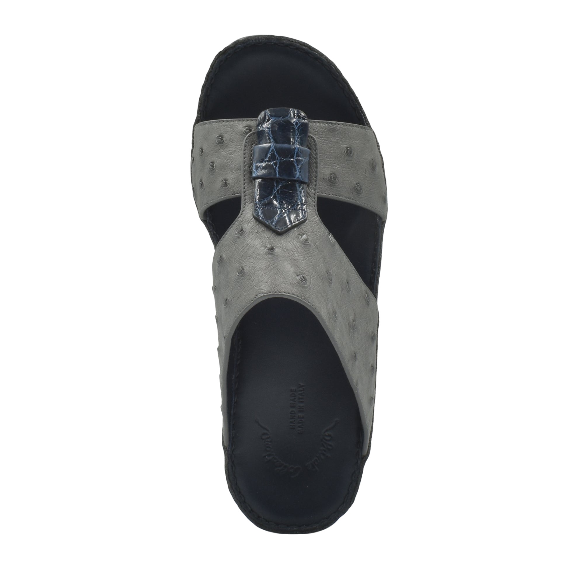 Top view of gray ostrich leather sandals with black sole and detailed strap design