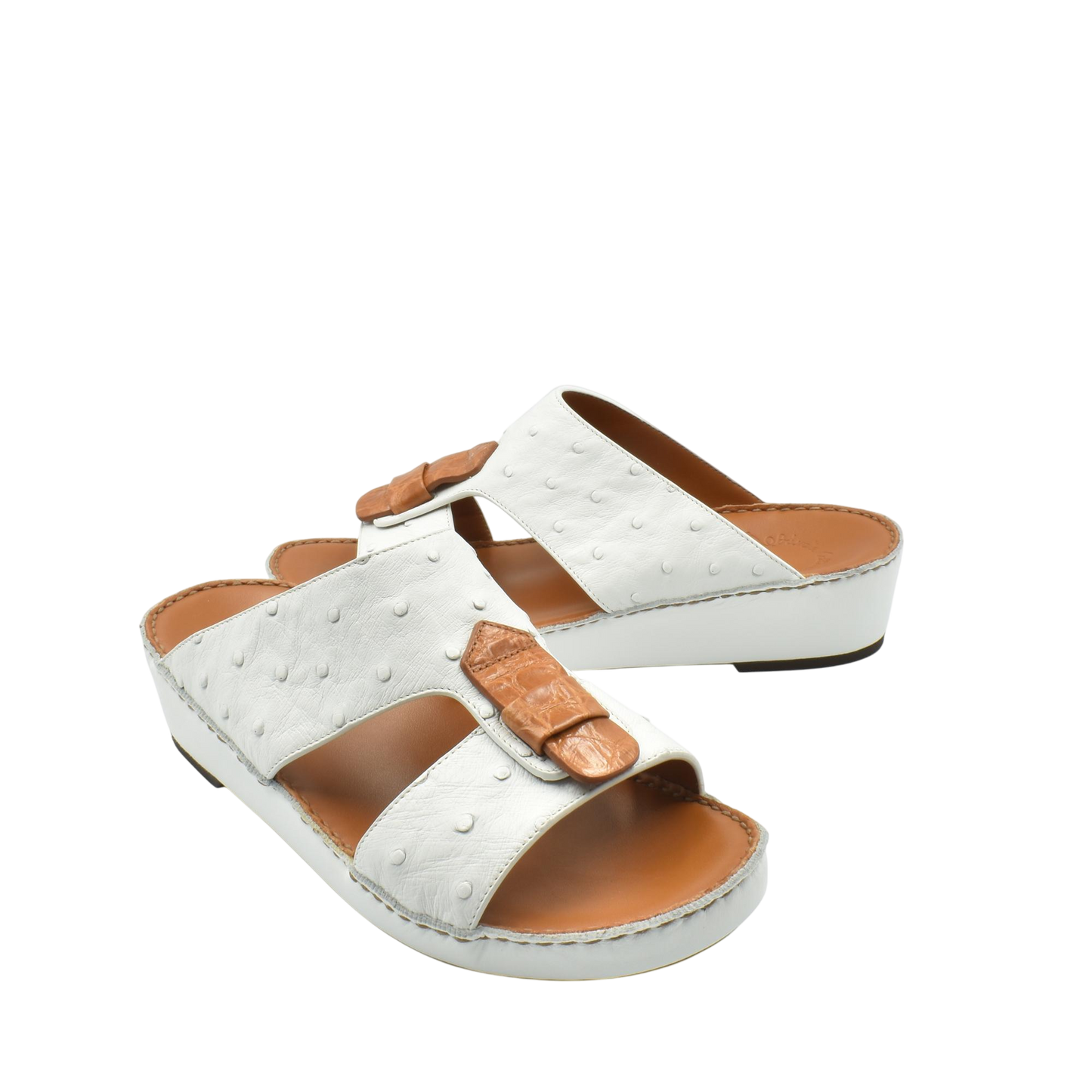 White ostrich leather sandals with tan leather details and comfortable cushioned sole