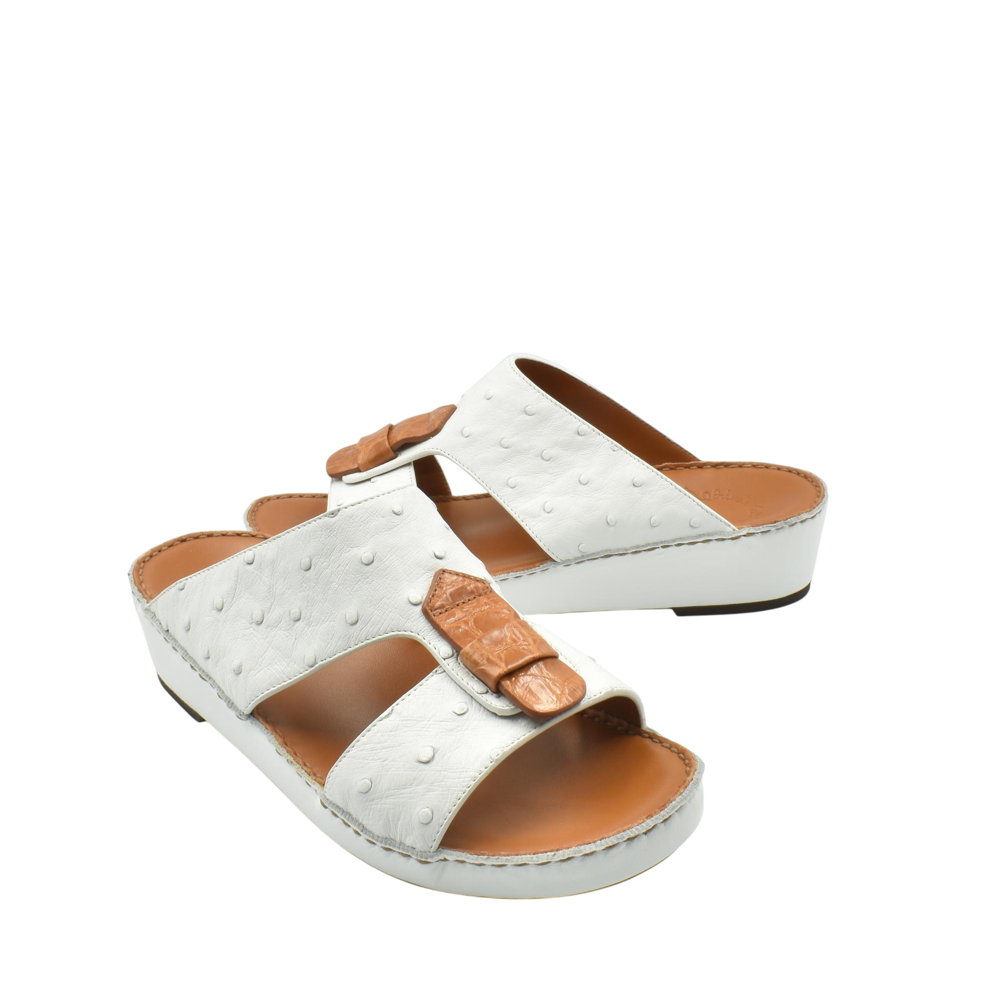 White ostrich leather sandals with tan leather details and comfortable cushioned sole