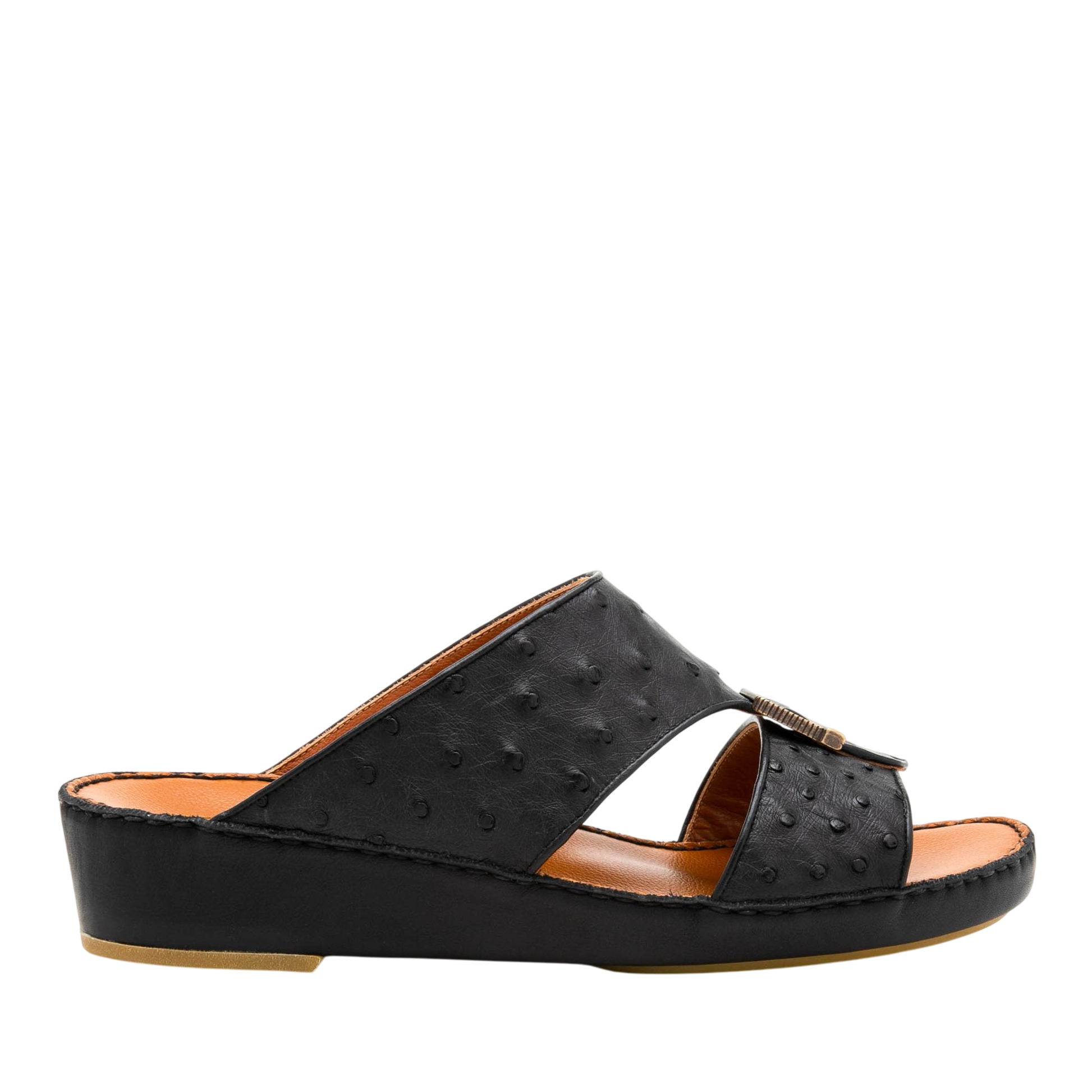 Black luxury leather sandals with textured upper and low wedge heel for comfortable wear